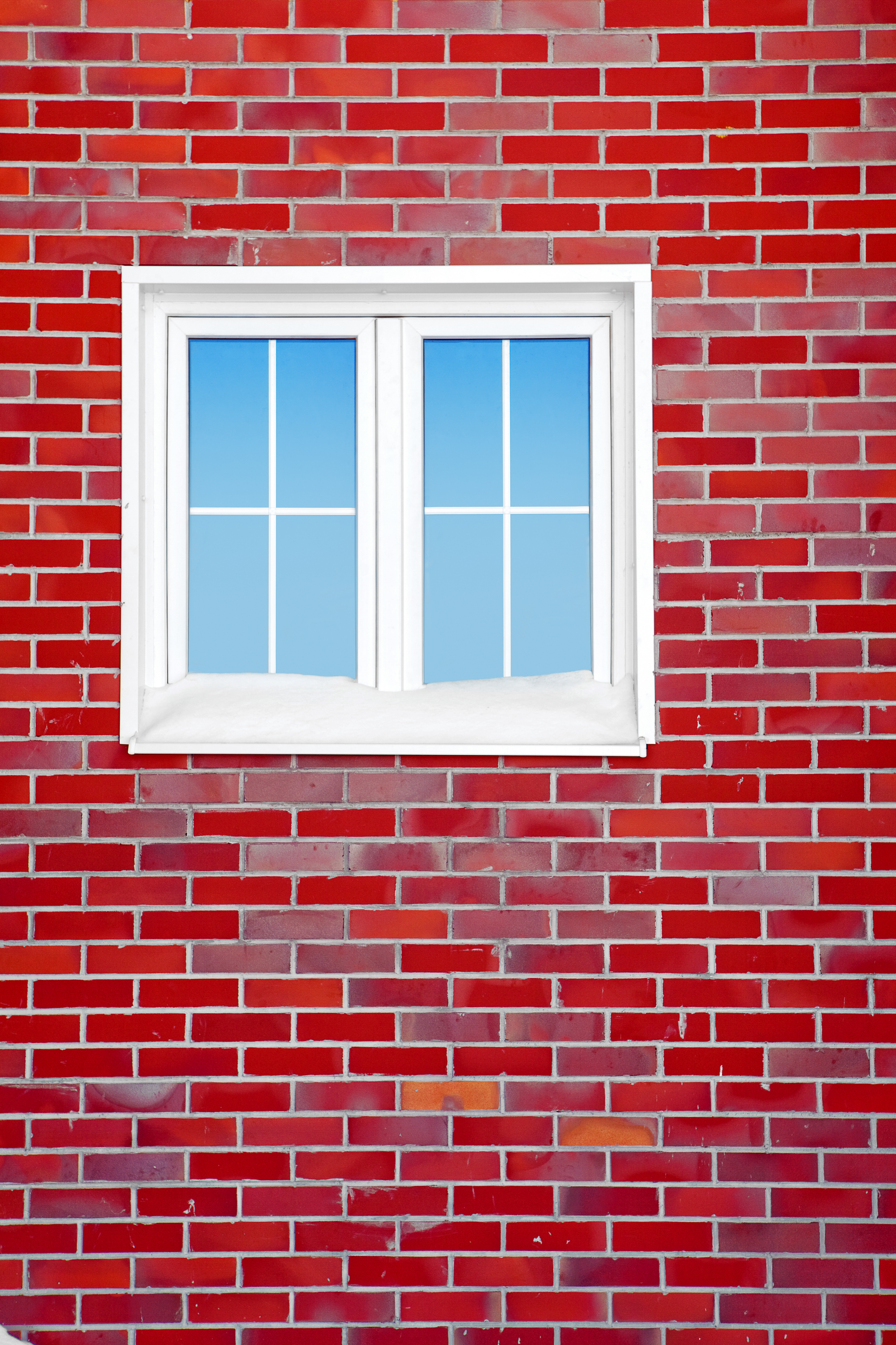 Red brick wall with window photo