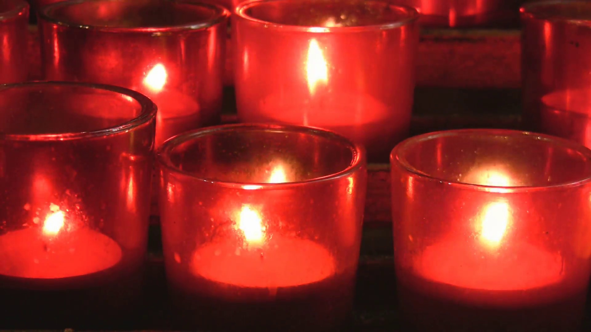Red church candles. Closeup of red votive candles from a Christian ...