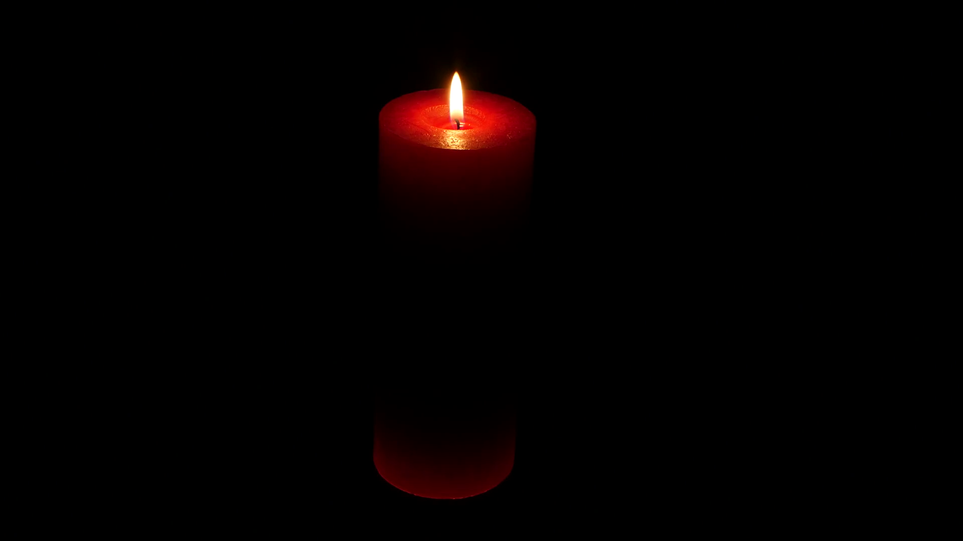 Candle flame isolated on black. Red candle. Close up Stock Video ...