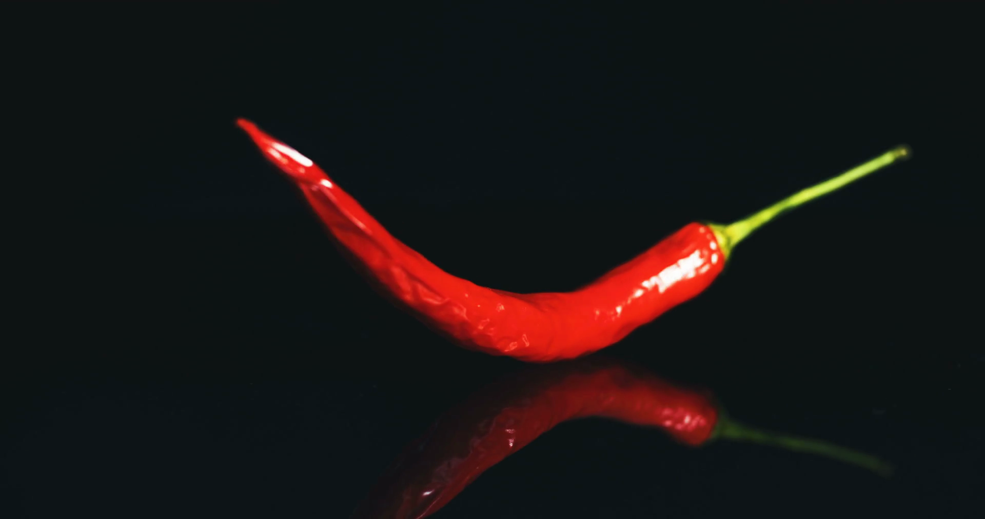 red chilli pepper. Black background 4K Stock Video Footage - Videoblocks