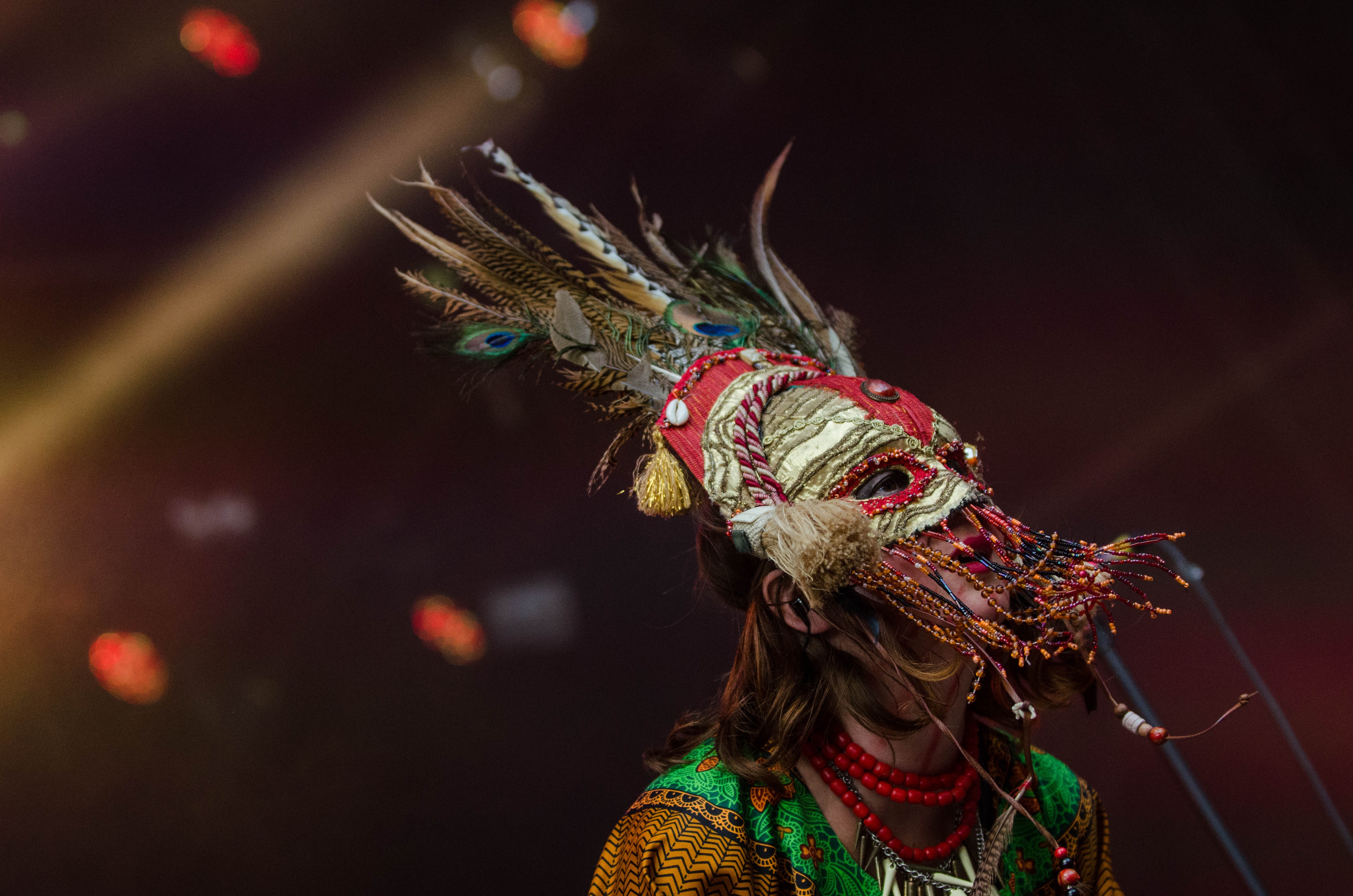 Red grey feathered festival mask photo