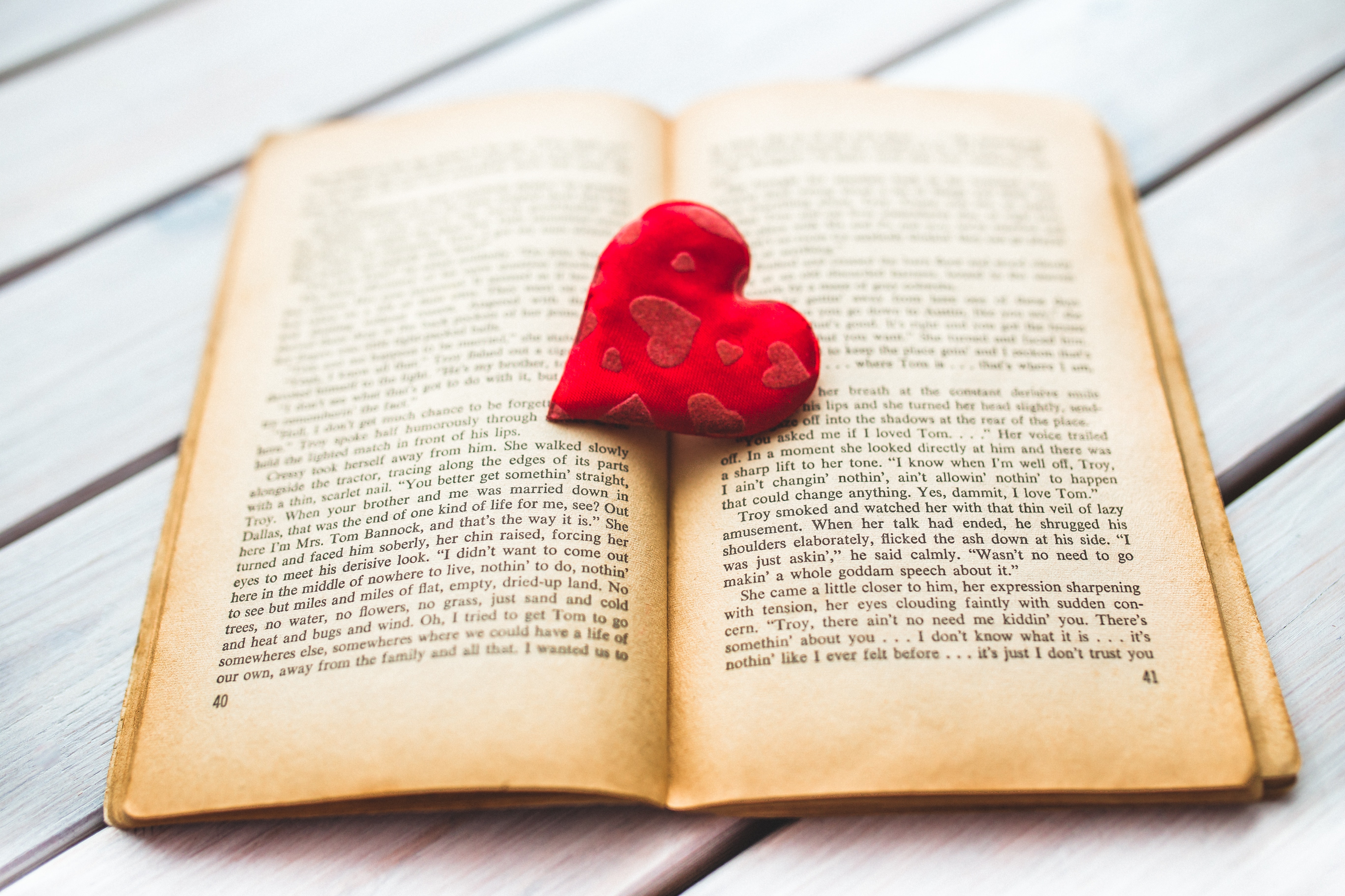 Red heart on a old opened book ii photo