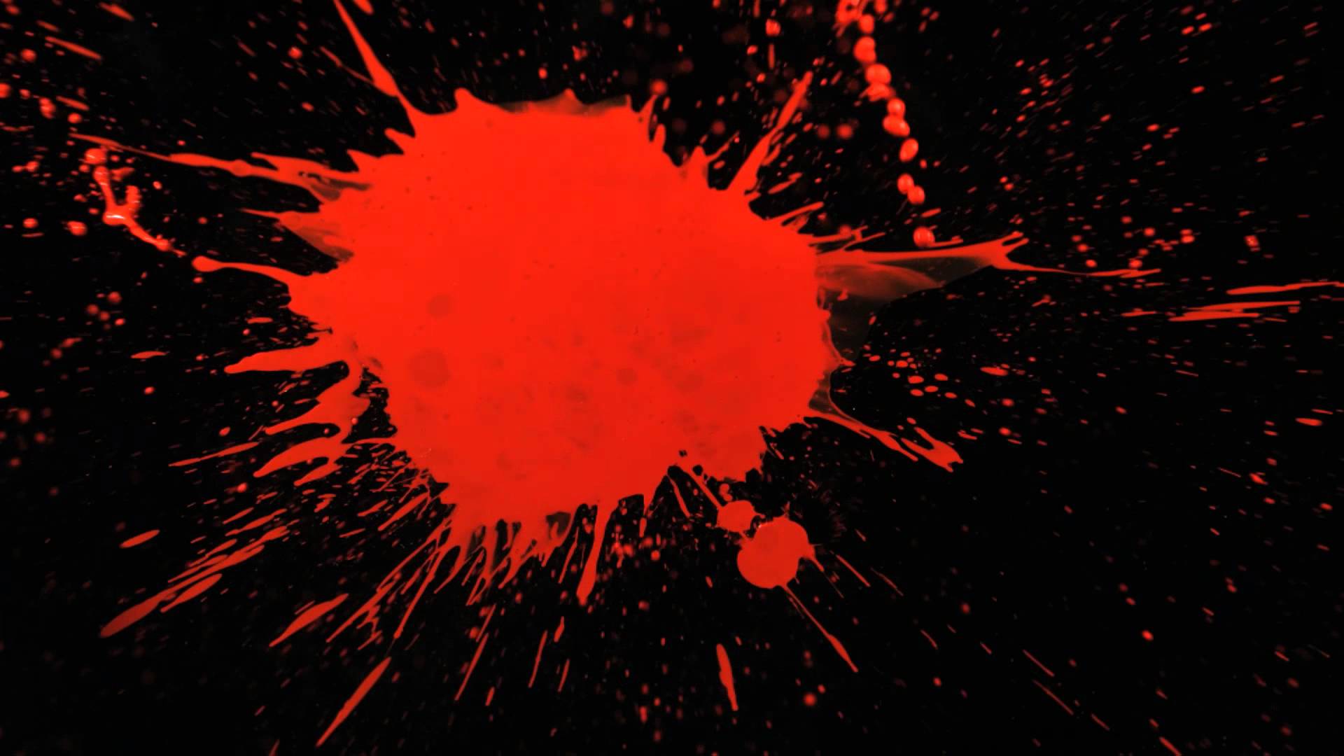 Slow Motion Paint Splatter with Red Paint Splattering a Black ...