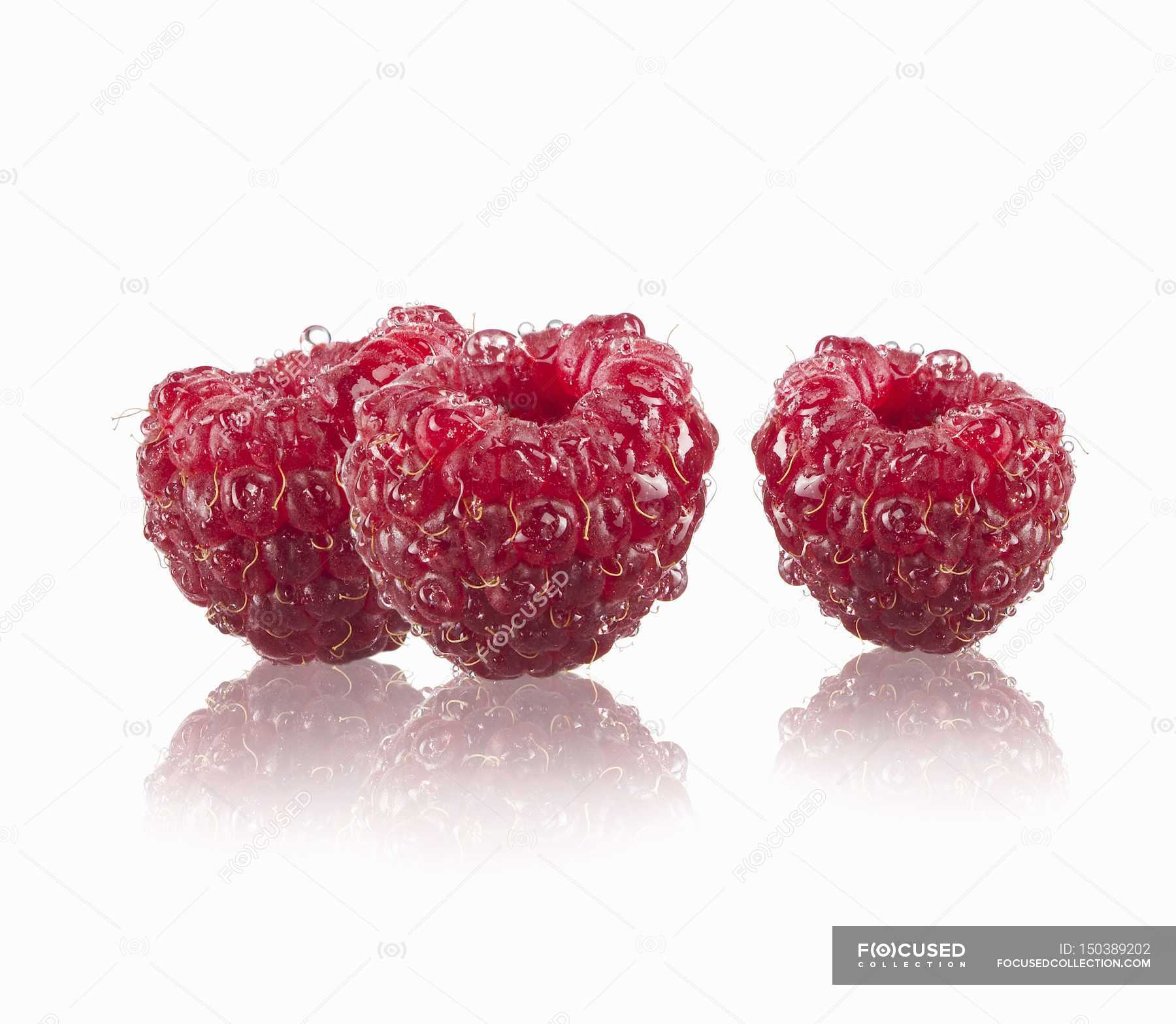 Three ripe raspberries — Stock Photo | #150389202