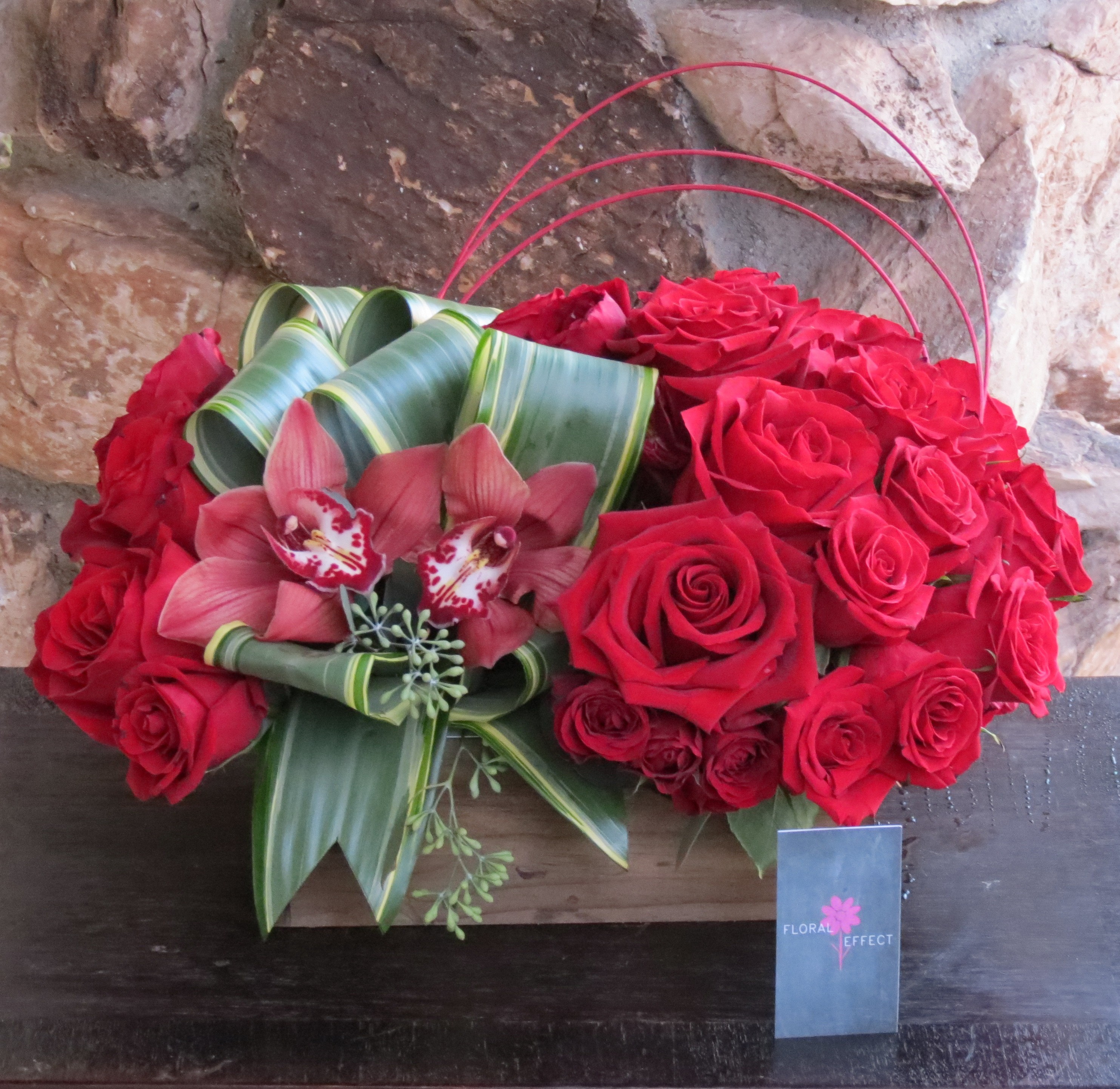 Red roses and cymbidiums on a box in Santa Clarita, CA | Floral Effect