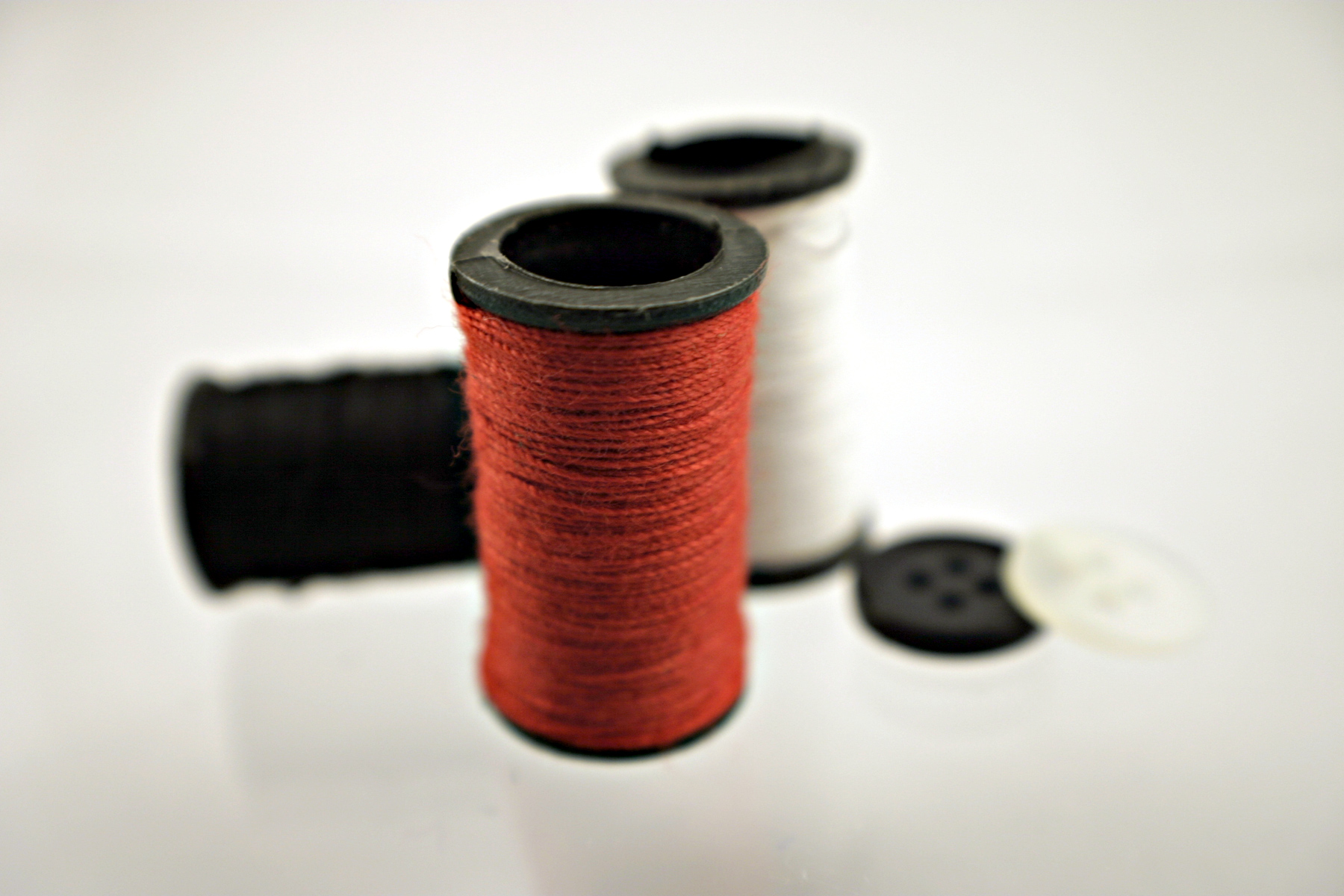 Red thread and buttons photo
