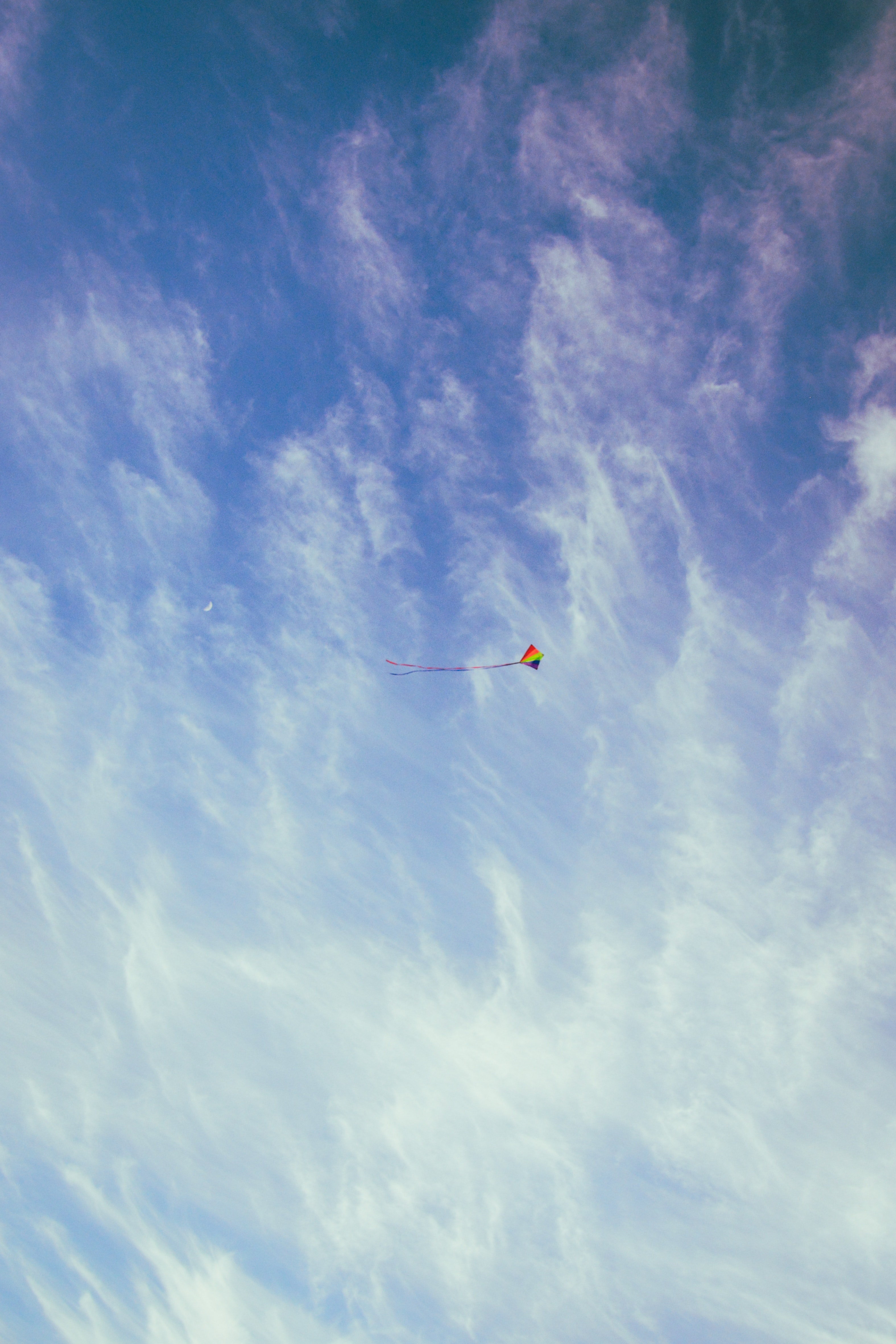 Red yellow and blue kite on the sky photo