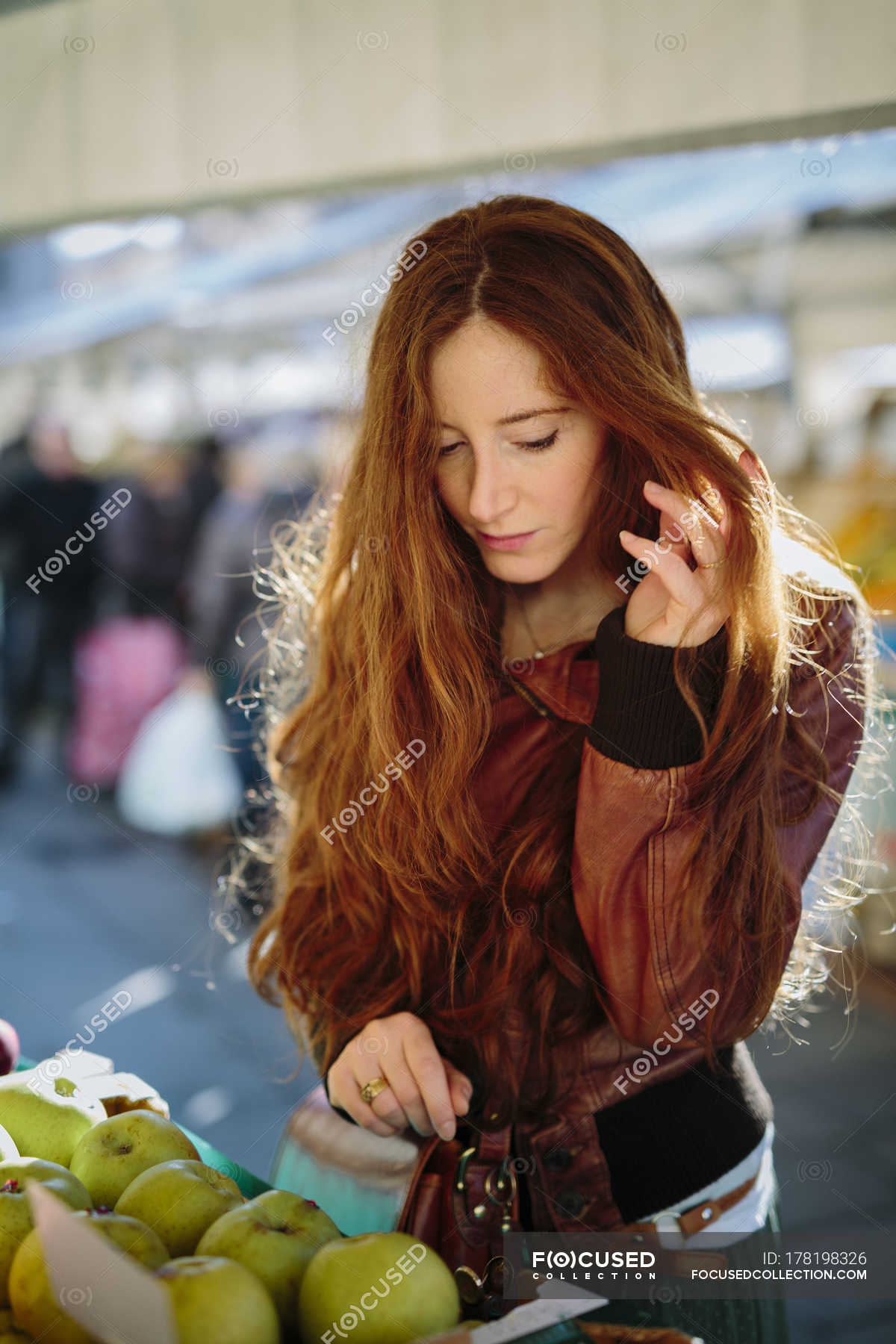 Redheaded Woman at fruit market — Stock Photo | #178198326