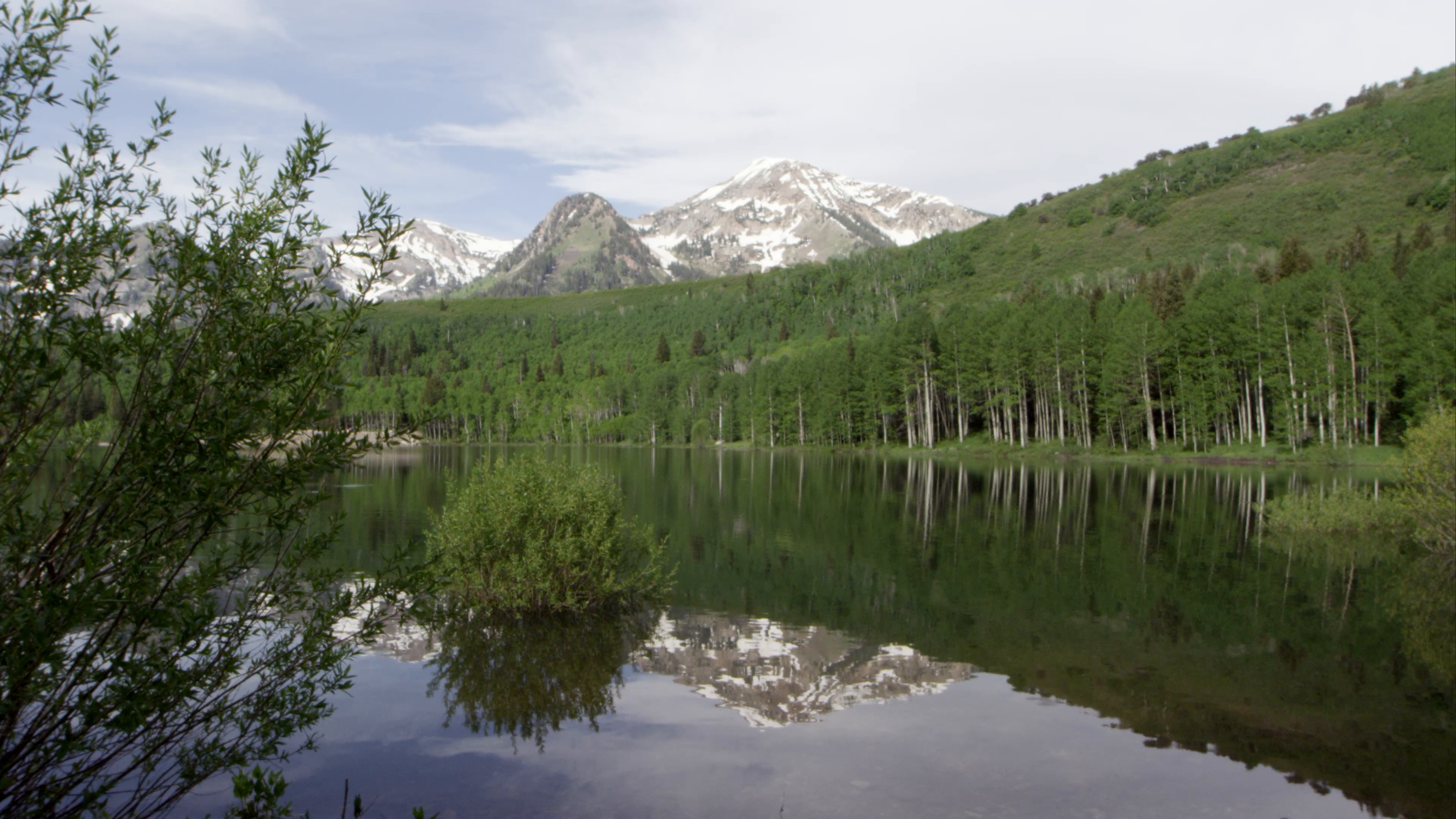 Static view of mountain scene reflecting in a Utah lake. Stock Video ...