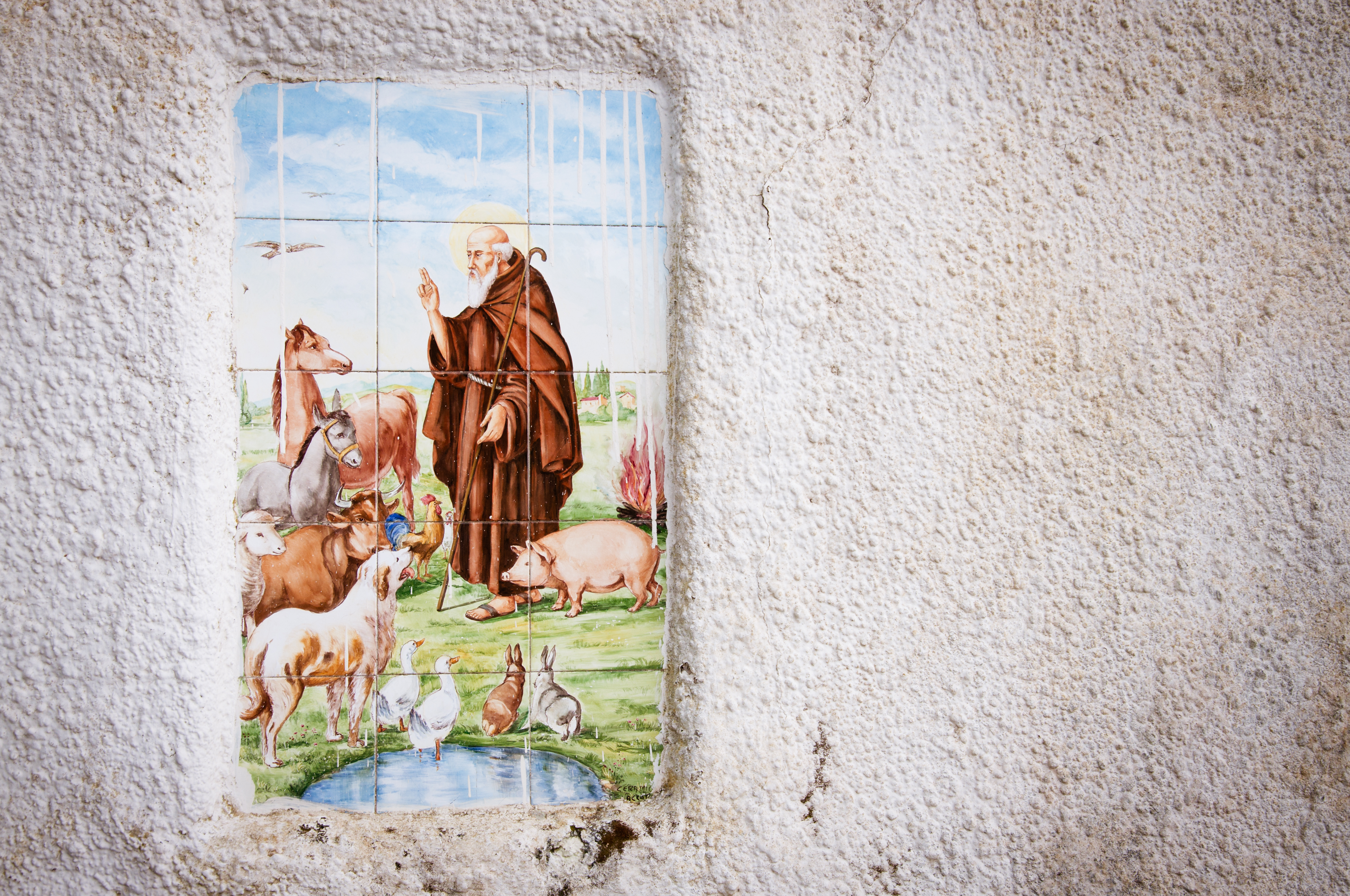 Religious tiles in street of italy photo