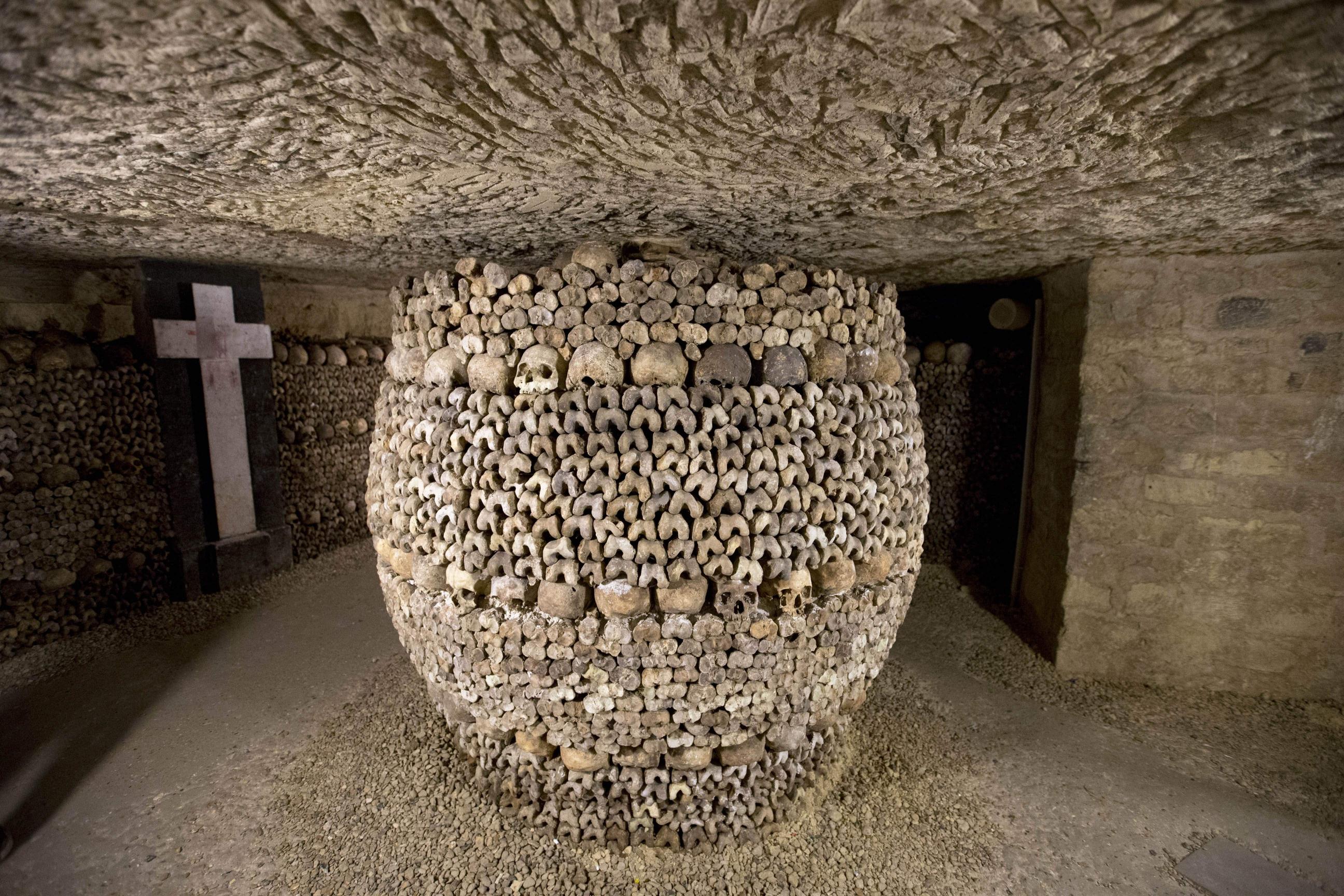 The artfully arranged catacombs of Paris hold the remains of about 6 ...