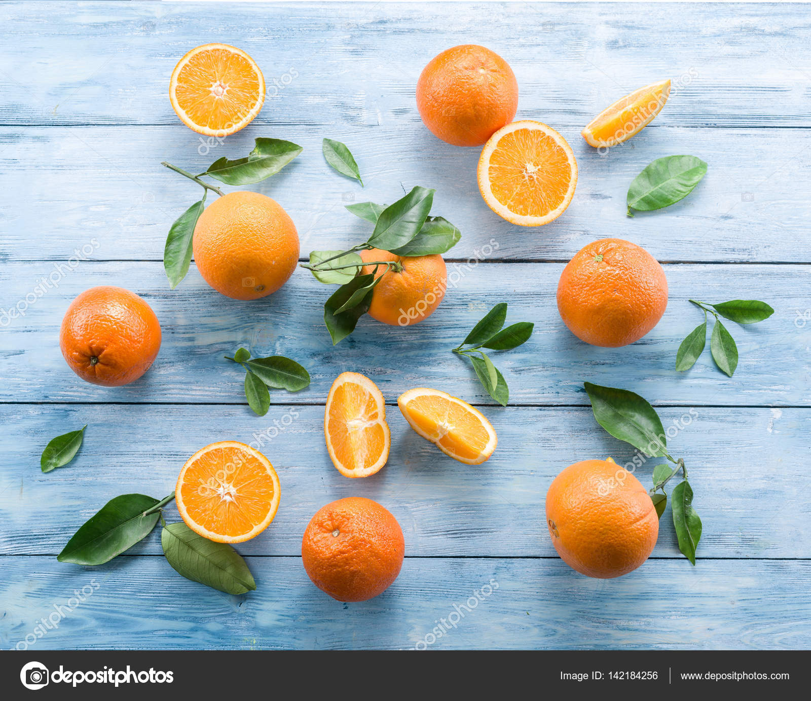 Ripe oranges on the blue wooden table. — Stock Photo ...