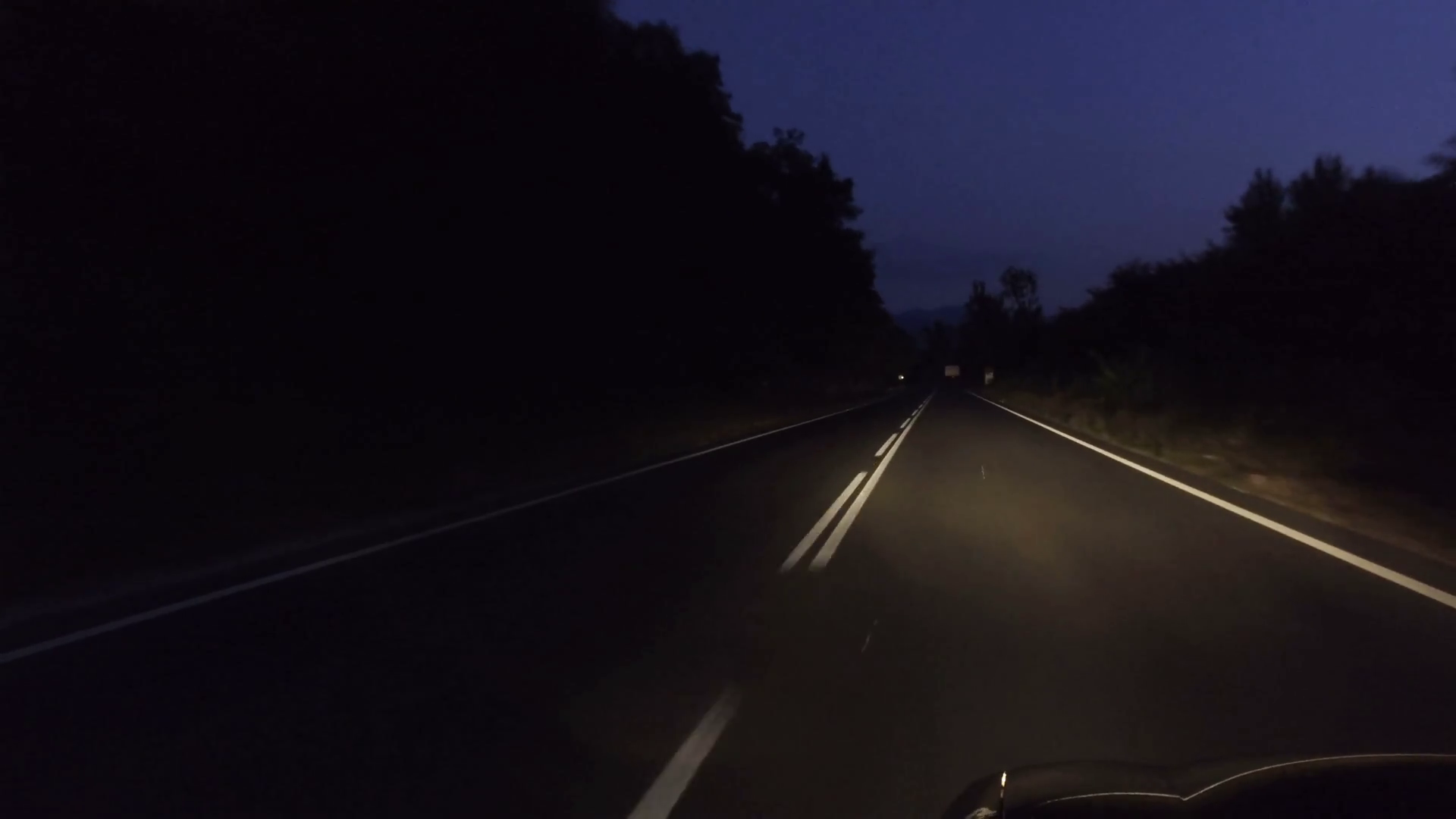 Driving on rural road at dark night with headlights on, gopro Stock ...