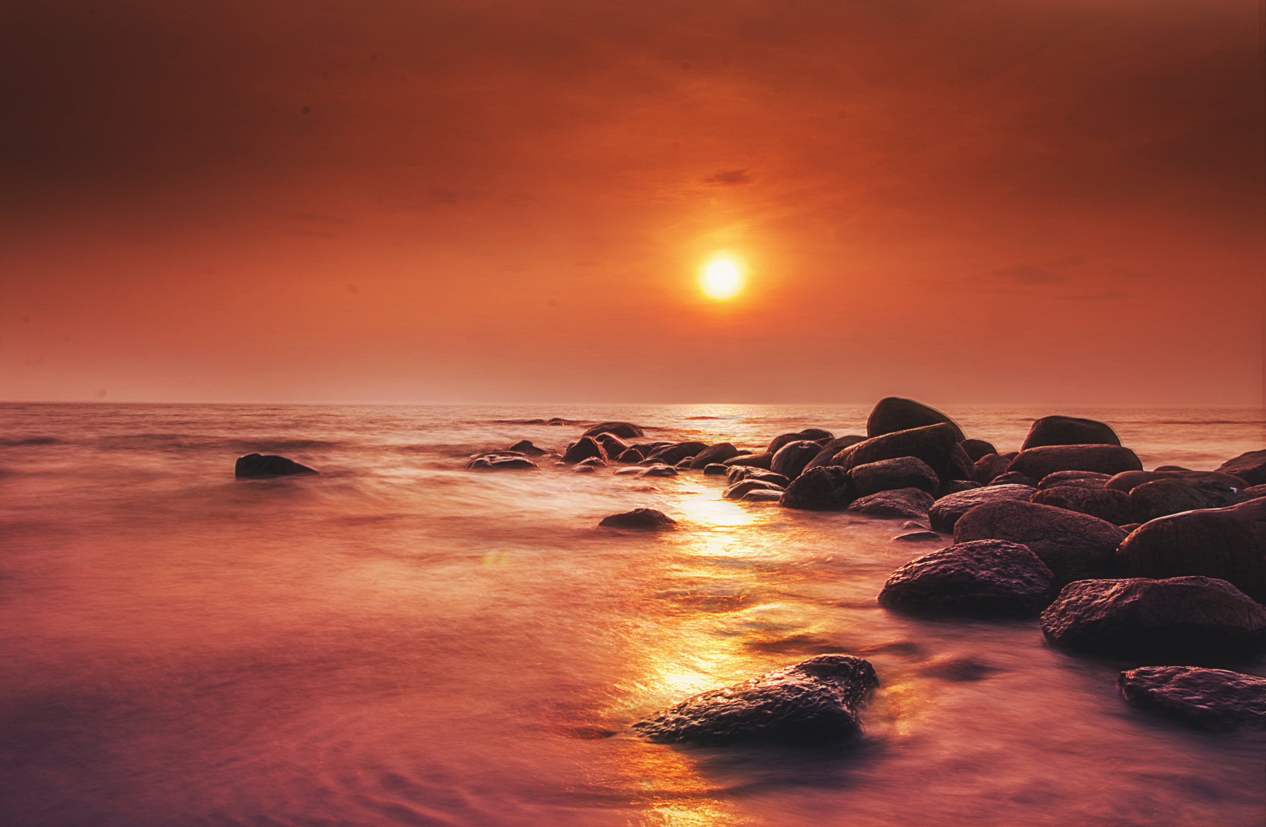Rocky shore under golden sun at the horizon HD wallpaper | Wallpaper ...