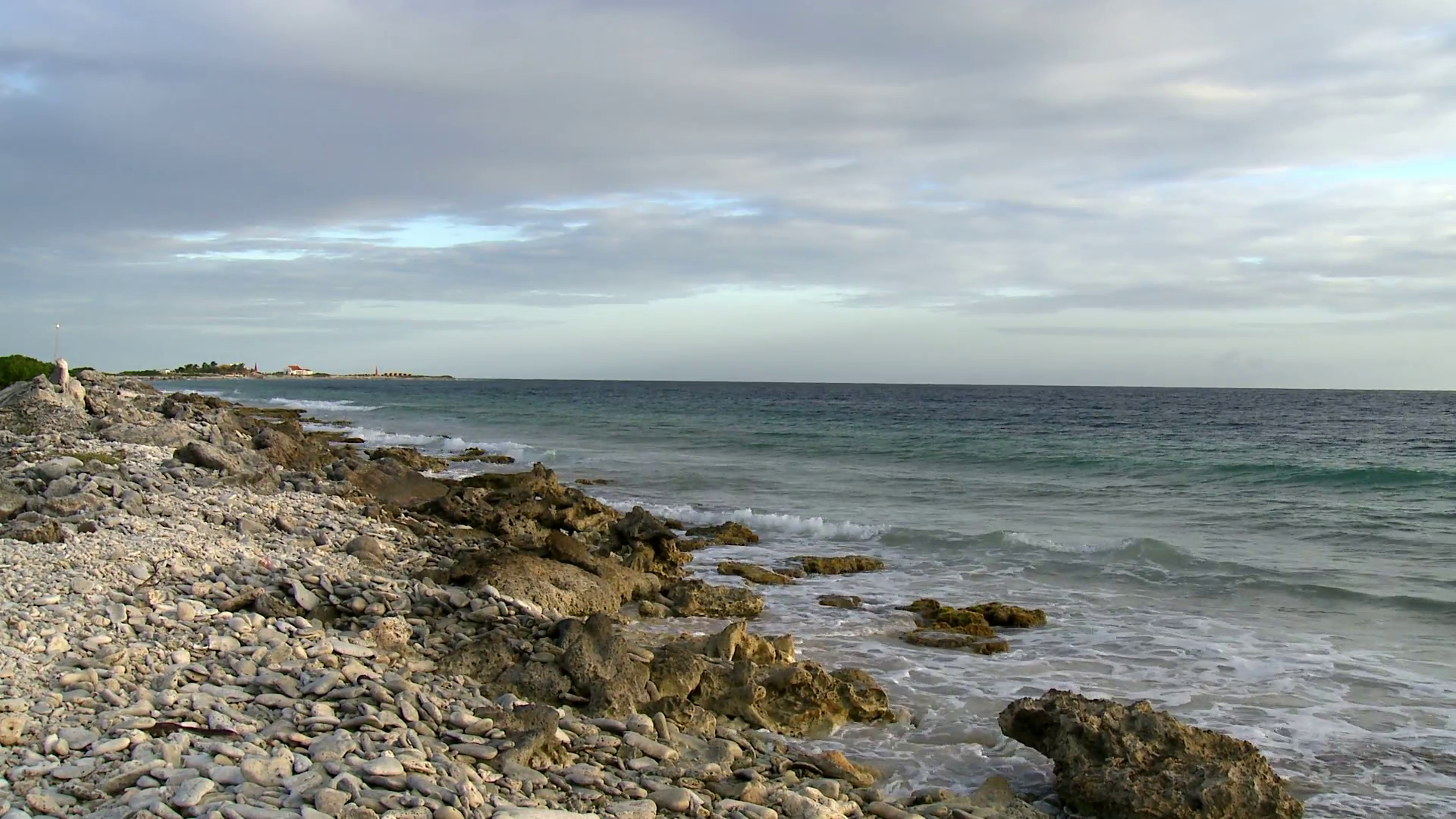 Caribbean travel tourism waves crashing on rocky shore in caribbean ...