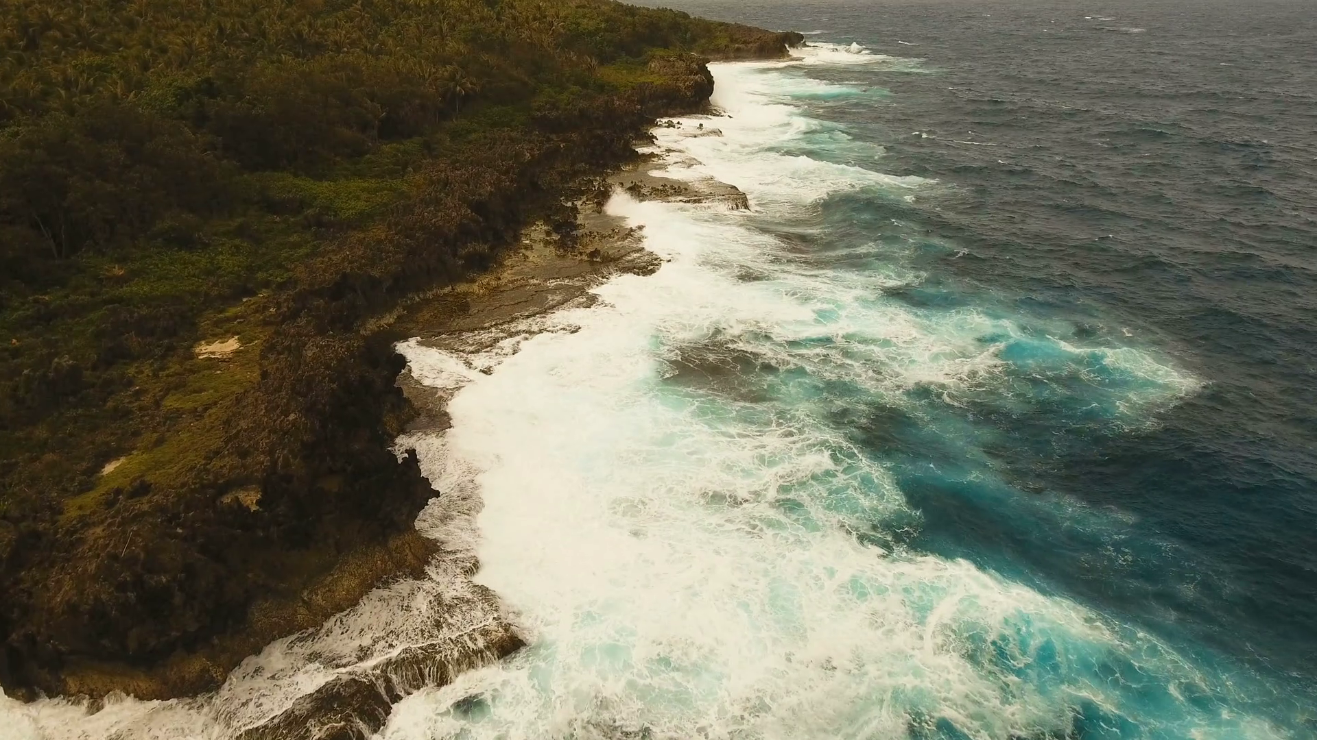 Rocky coast line in time stormy weather on island Siargao. Aerial ...