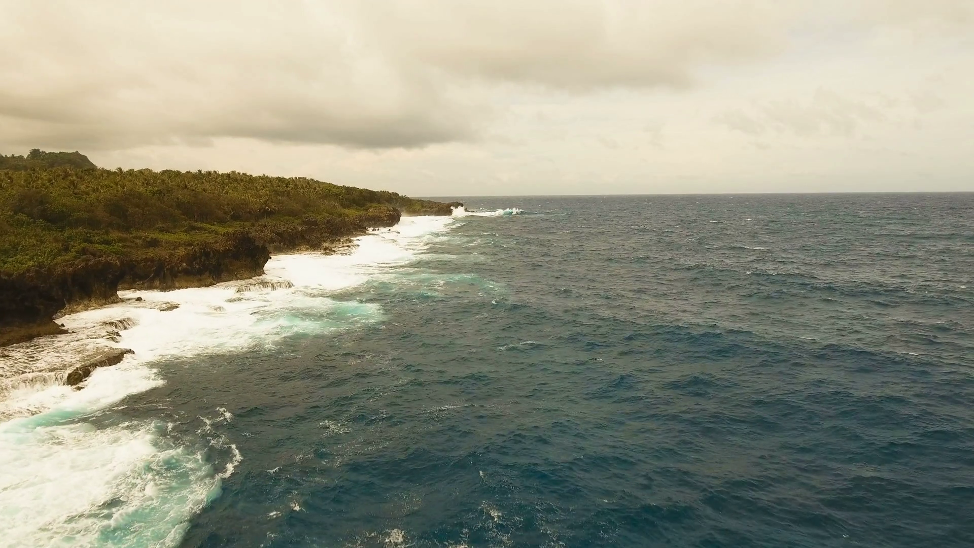 Rocky coast line in time stormy weather on island Siargao. Aerial ...