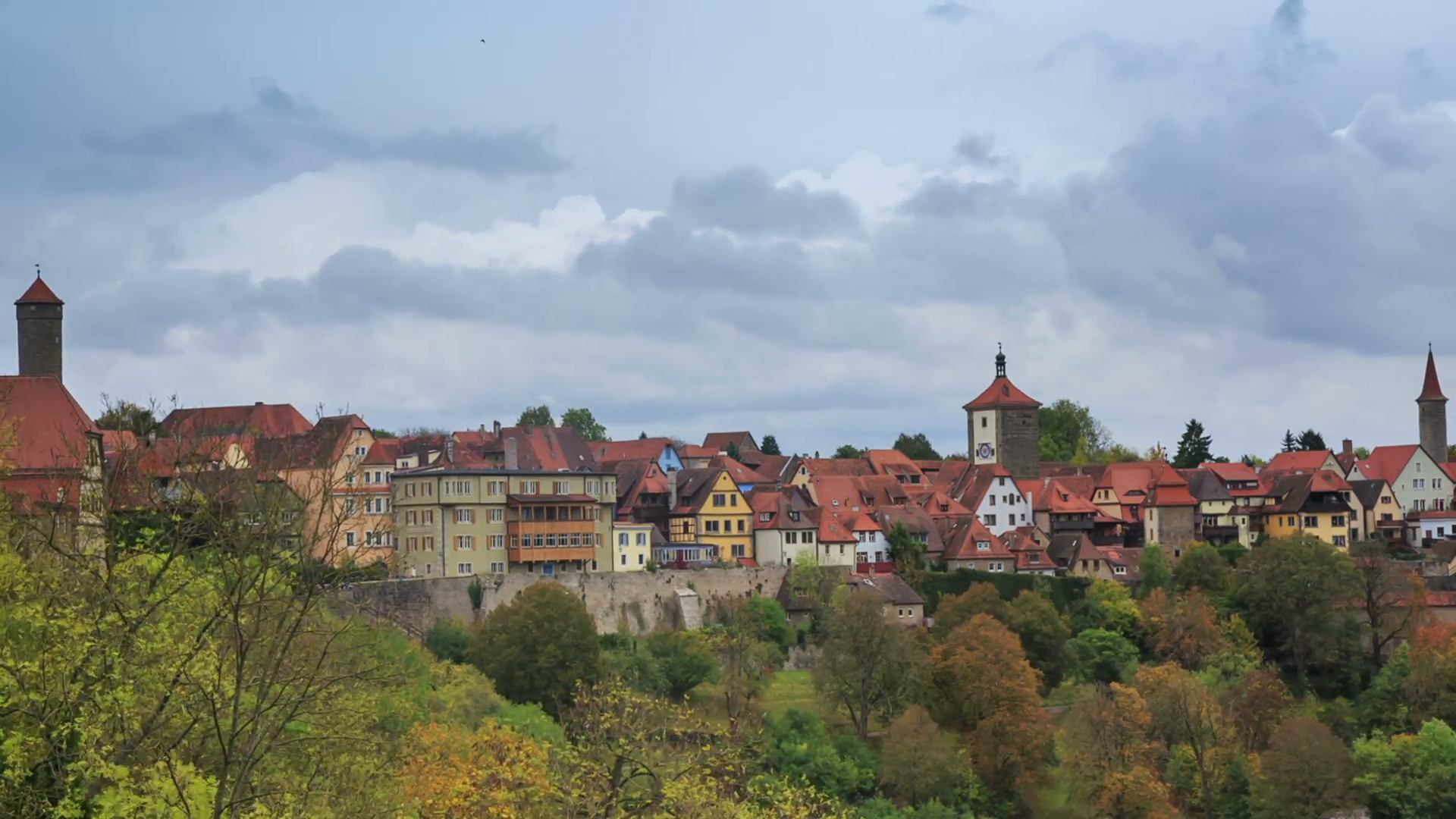Rothenburg on Tauber cityscape above the forest, cloudy timelapse ...