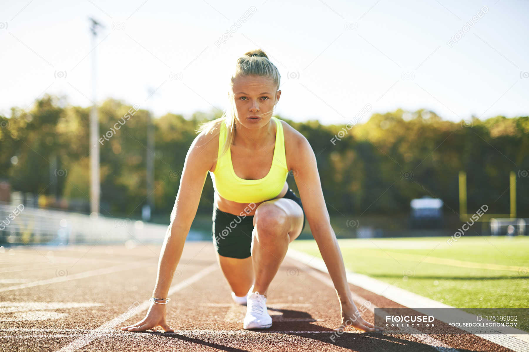 A Female Runner In The Starting Position — Stock Photo | #176199052