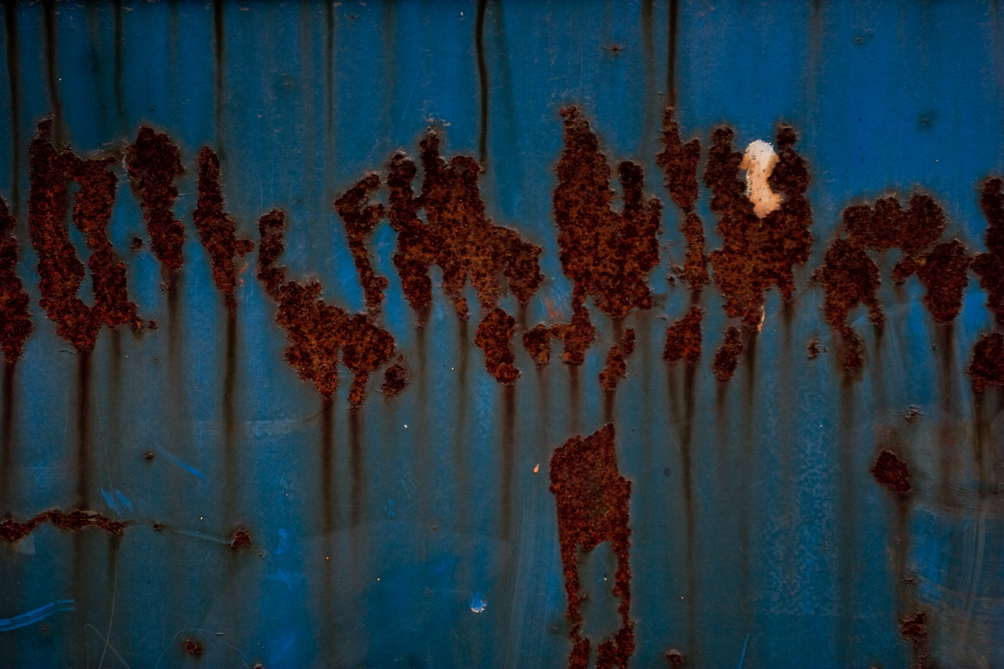 Rust on blue metal photo