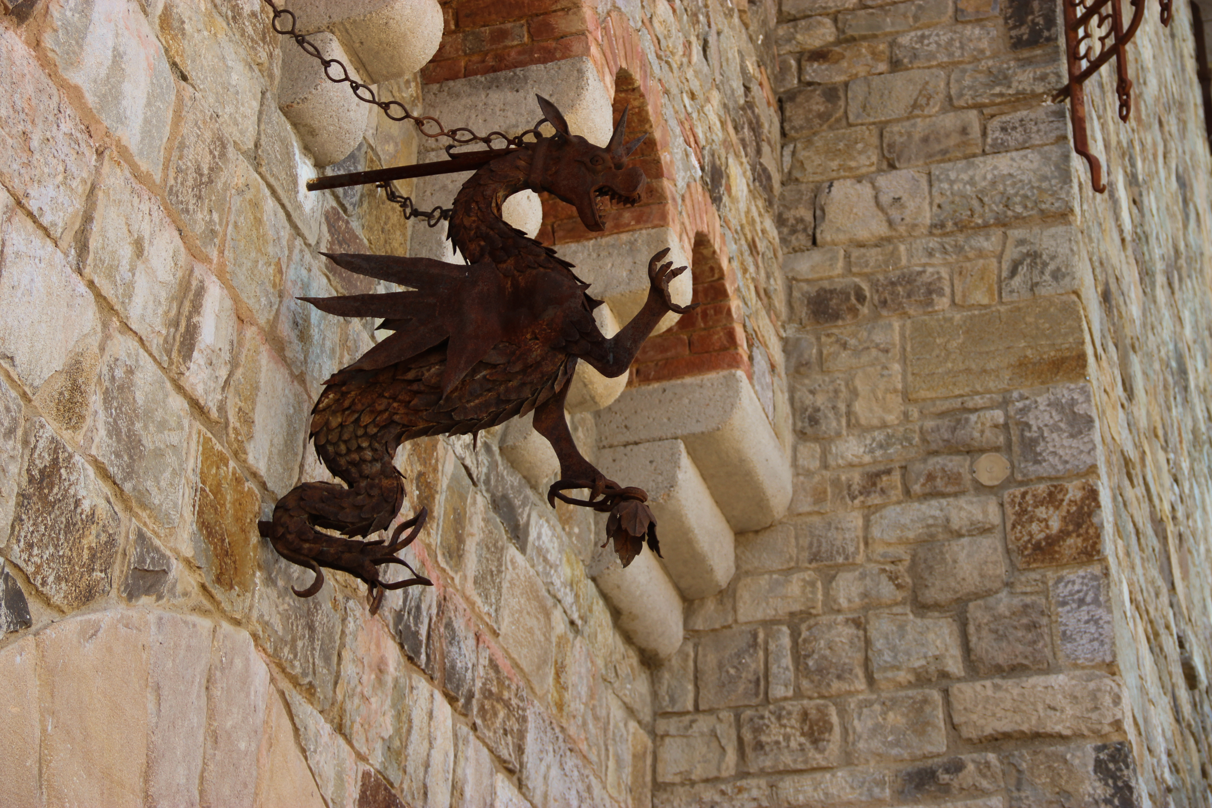 Free Stock Photo of Rusted Metal Dragon Emblem