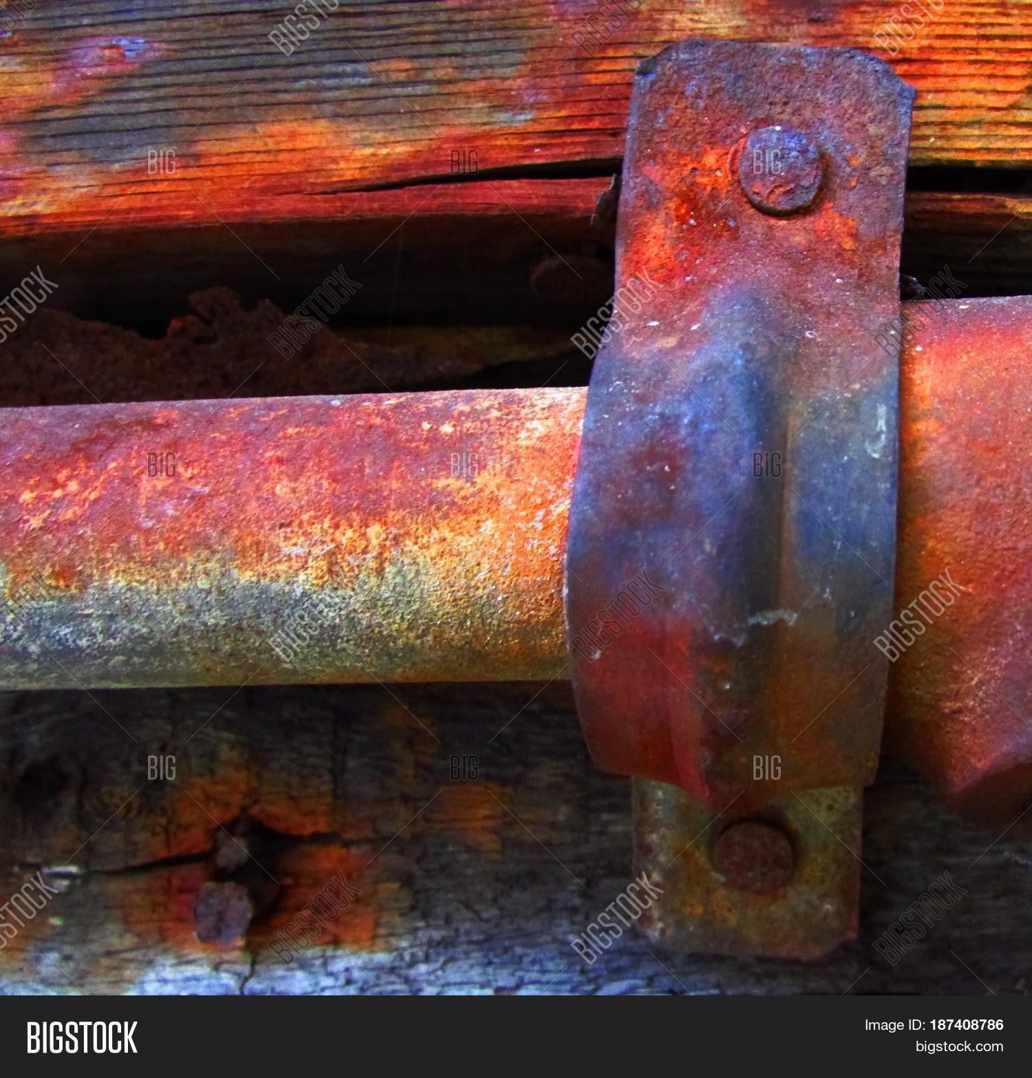 Rusted Metal Pipe Held Place By Image & Photo | Bigstock