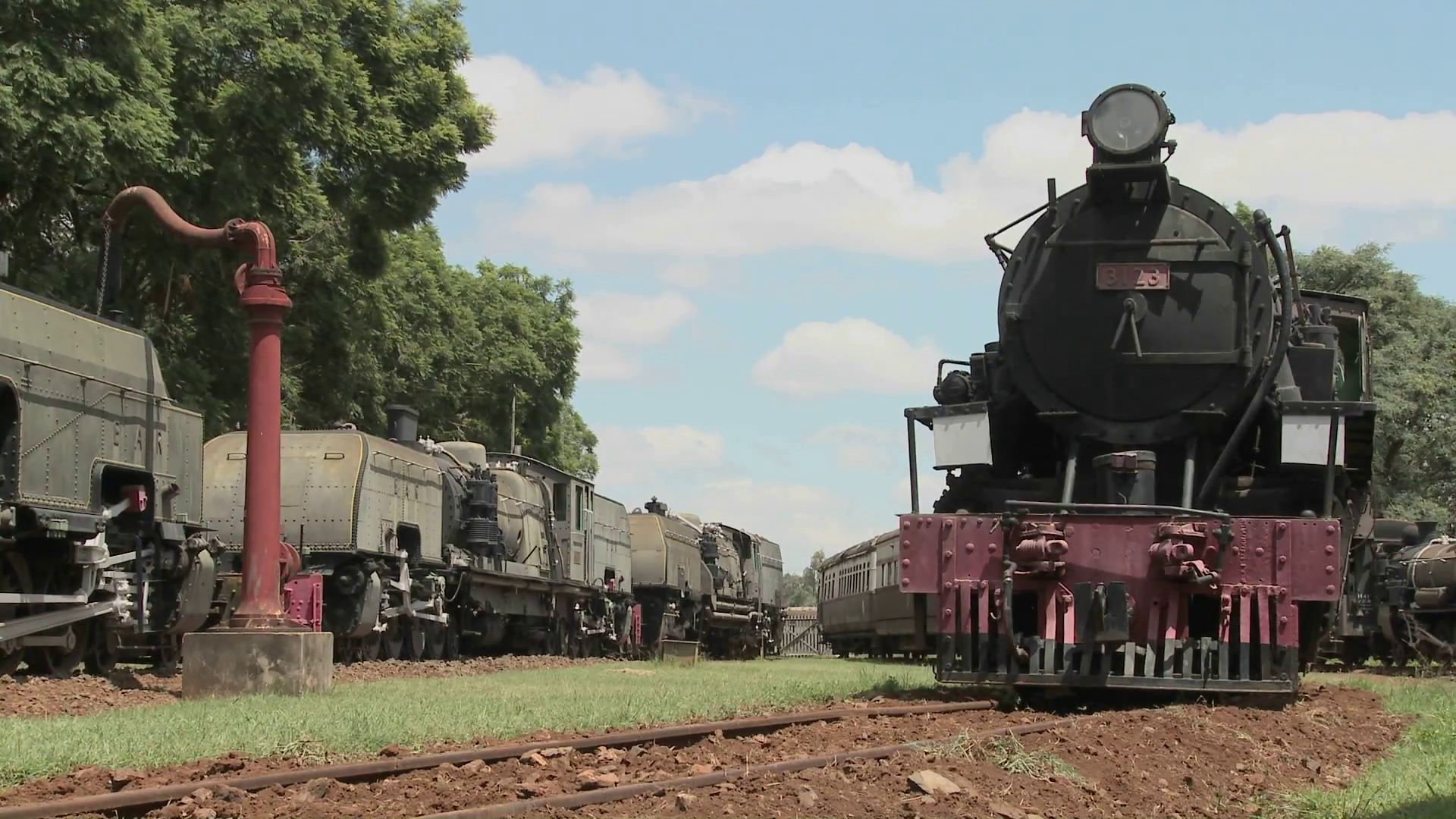 Old rusting steam trains sit in a railway yard. Stock Video Footage ...