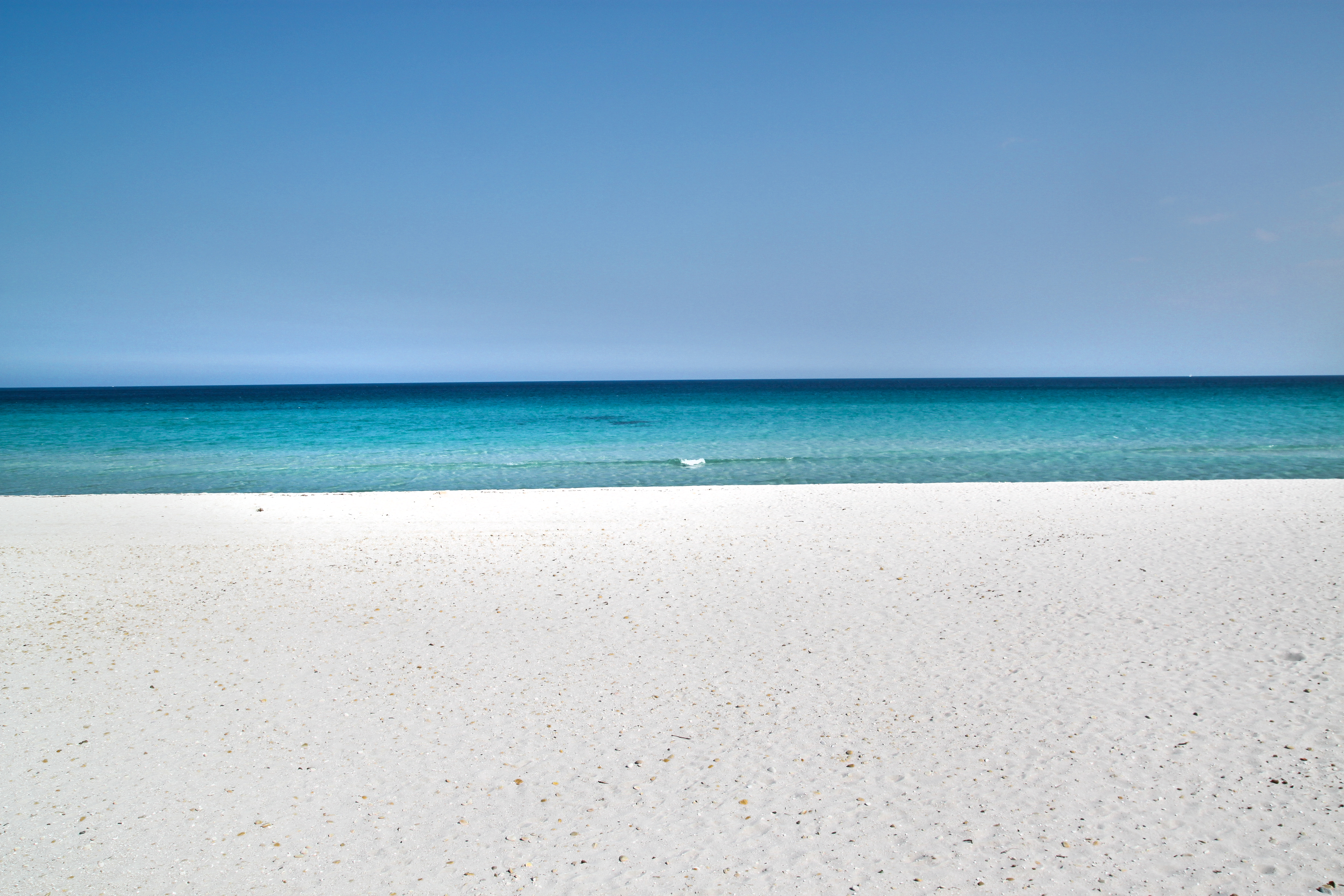 Sardinia sandy beach and blue sea photo