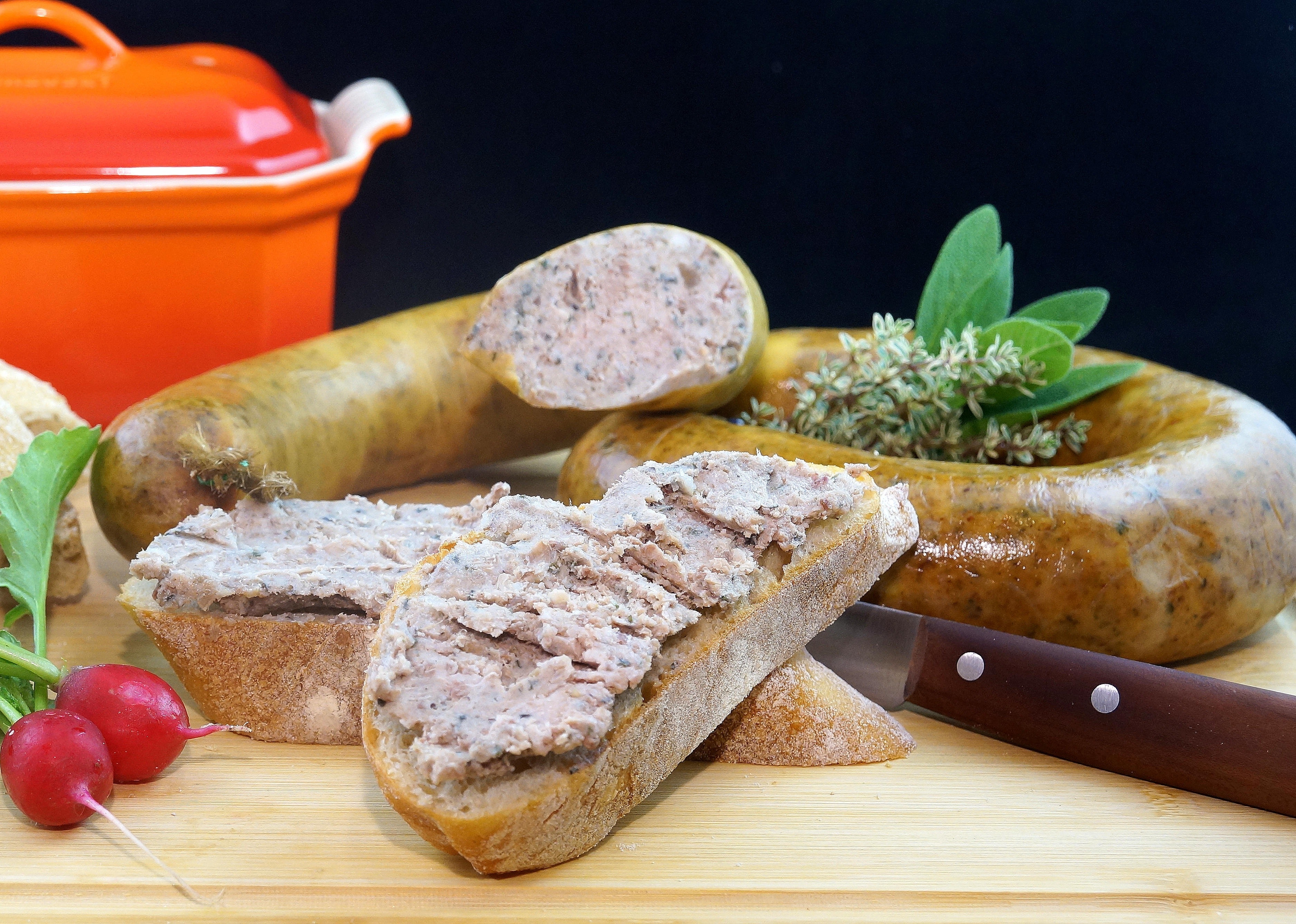 Sausage near kitchen knife photo