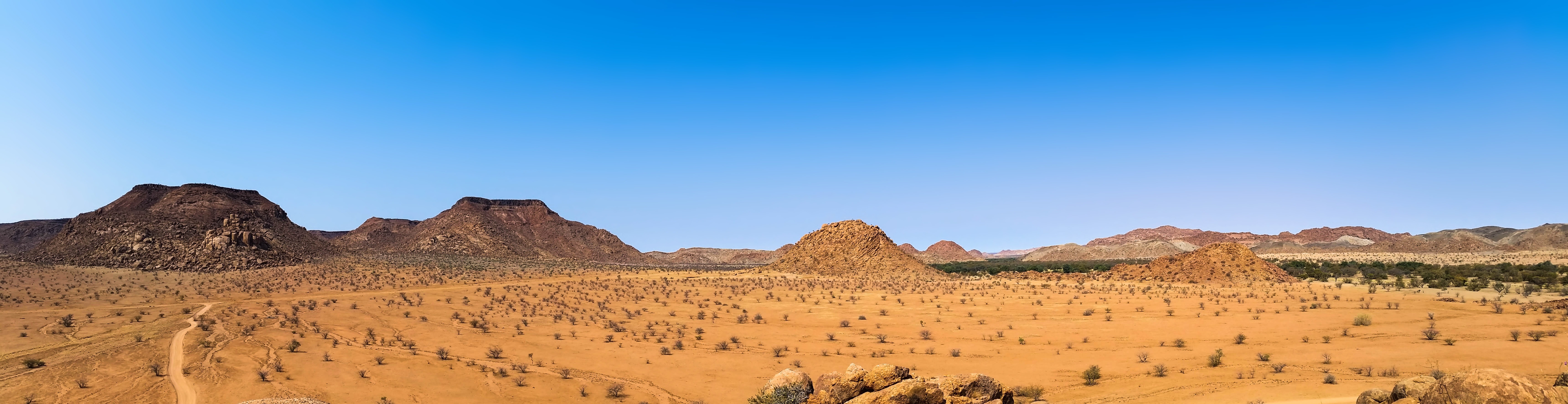 Scenic view of desert against clear sky photo