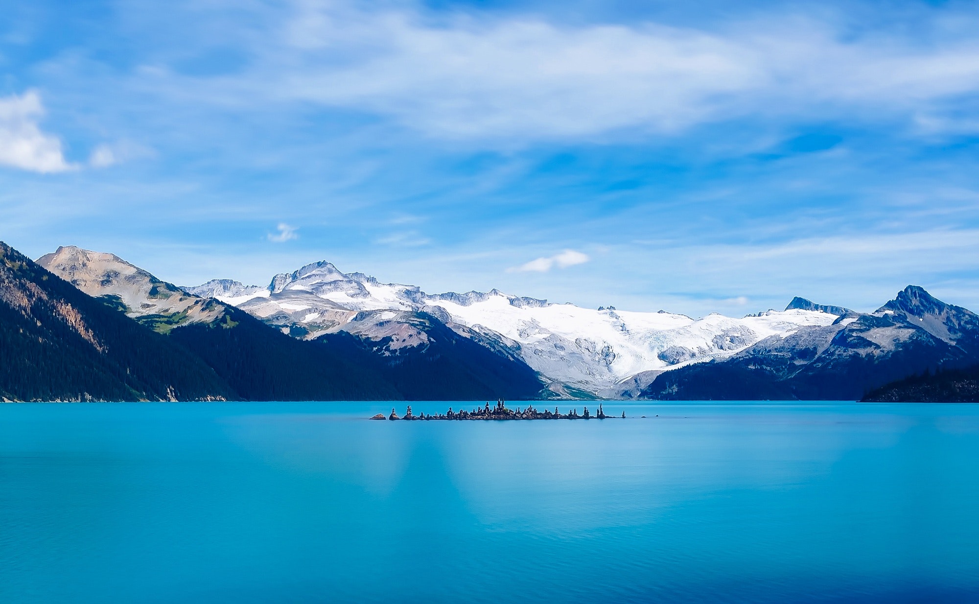 Scenic view of frozen lake against mountain range photo
