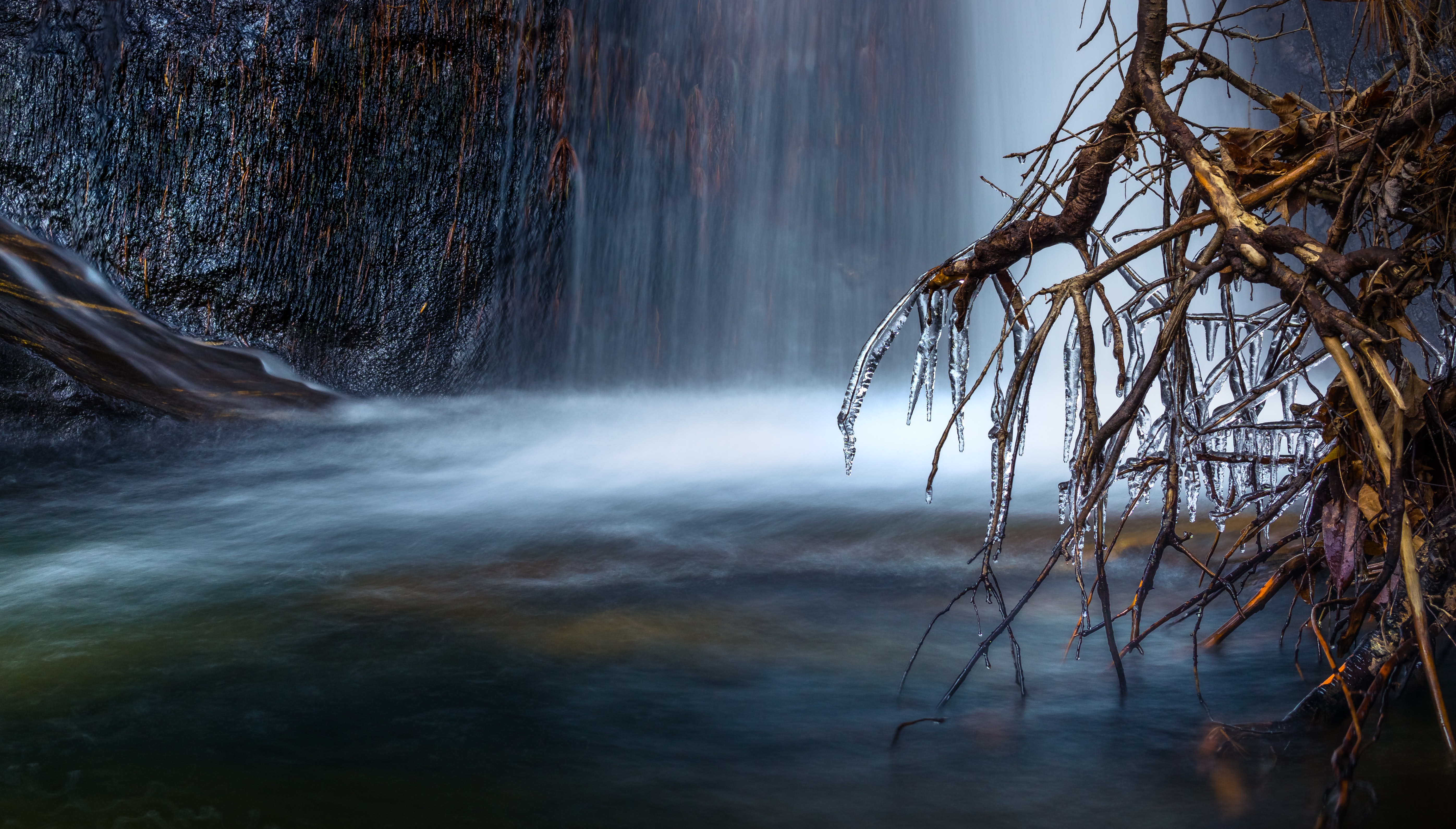 Scenic view of waterfall during winter photo
