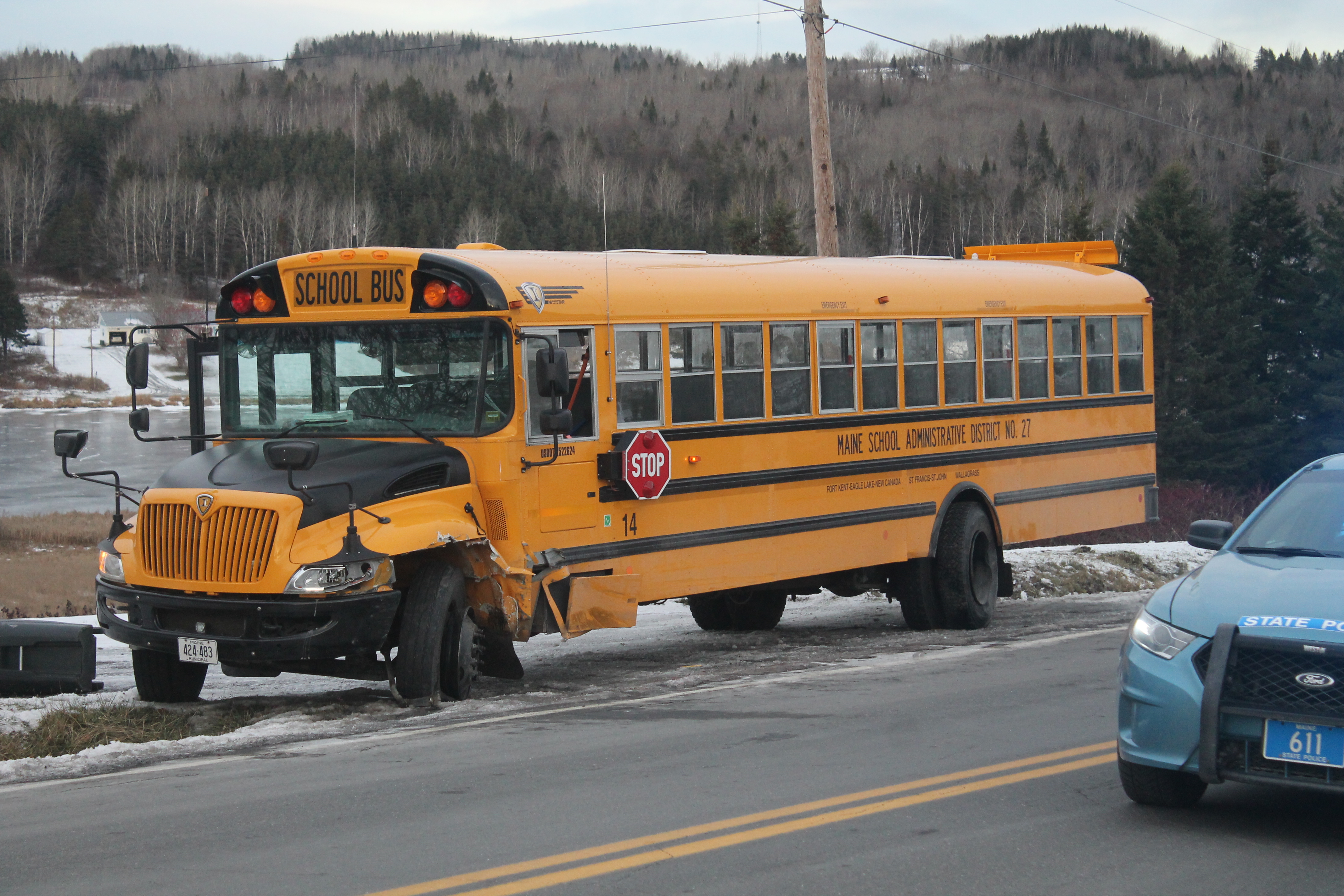 Car collides with school bus, eight students taken to hospital for ...