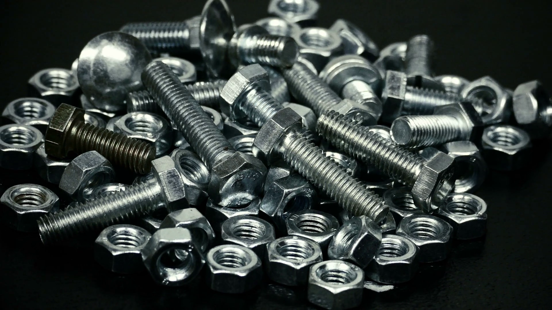 Bunch of screws and bolts rotating Stock Video Footage - Videoblocks