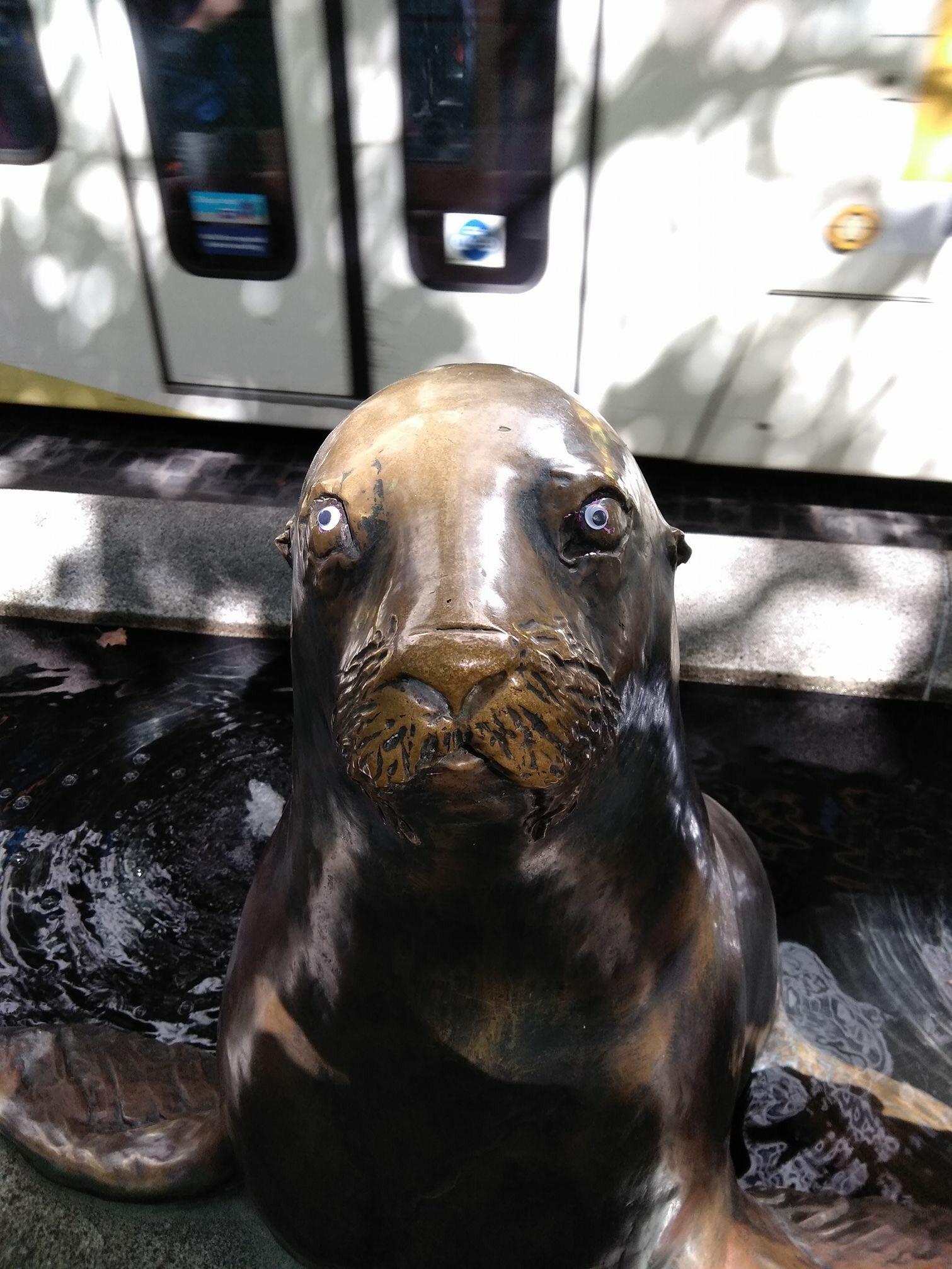 Somebody put googly eyes on the sea lion statues downtown. : Portland