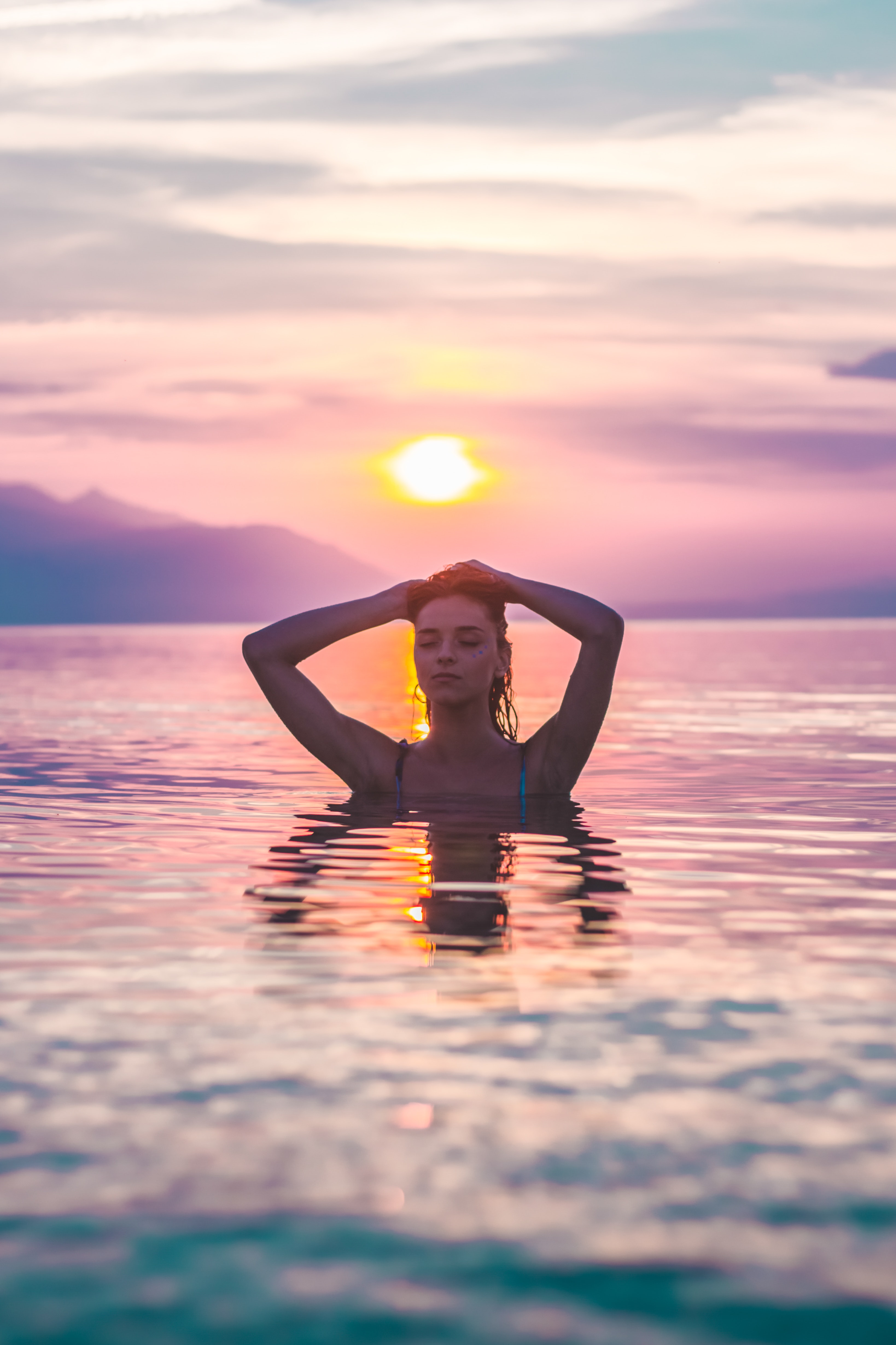 Selective Focus Photo of a Woman Bathing in Body of Water during Golden Hour, Beach, Relaxation, Water, Vacation, HQ Photo
