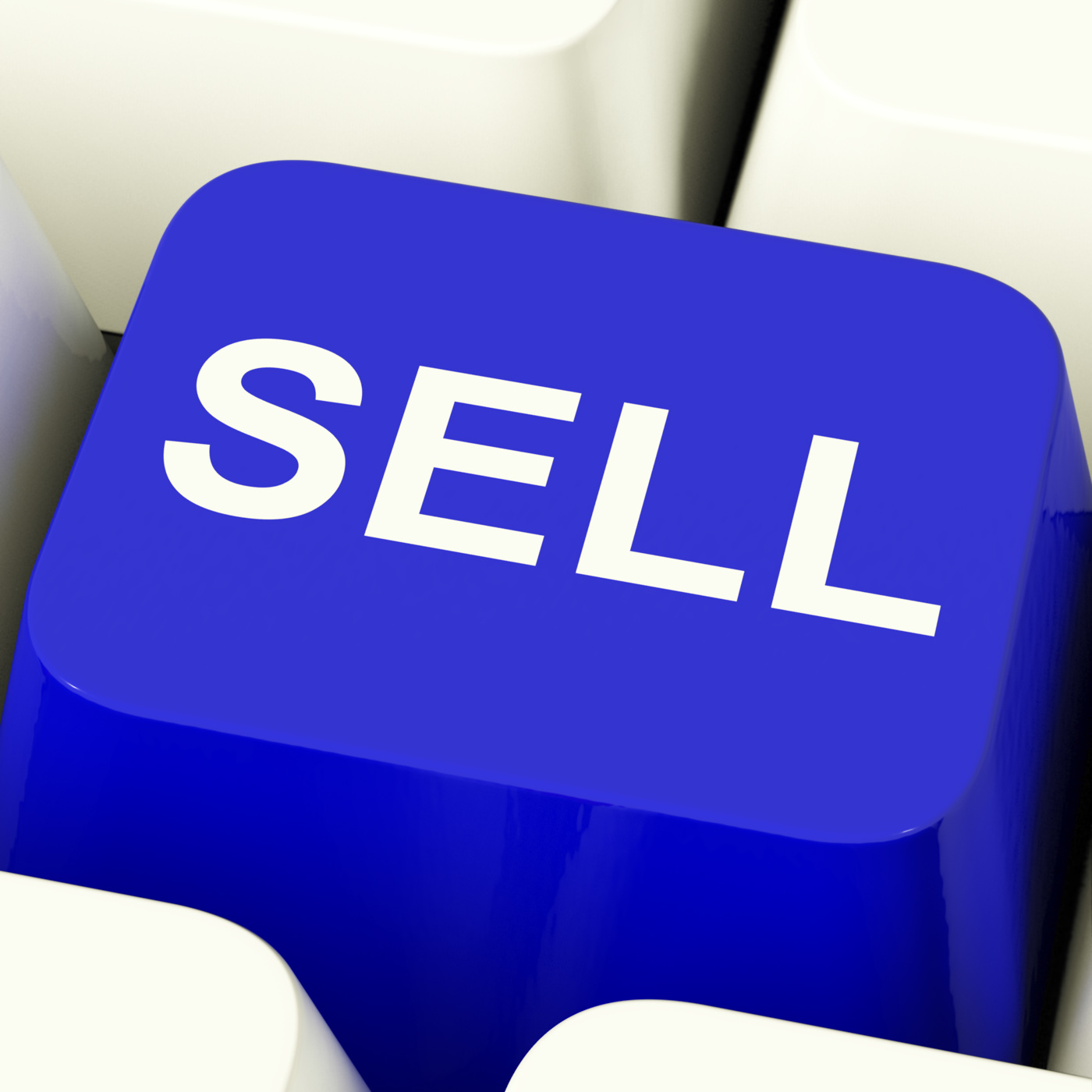 Sell computer key in blue showing sales and business photo