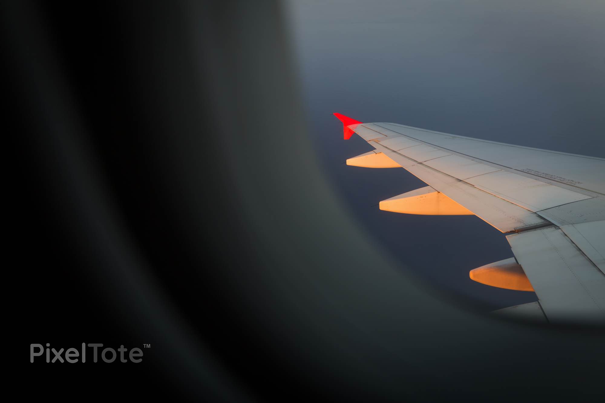 Airplane Wing Illuminated by Setting Sun Seen Through a Window Stock ...
