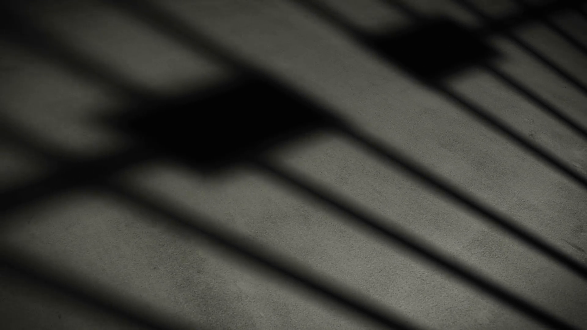 Prison cell door closing shadow on dark concrete jail floor ...