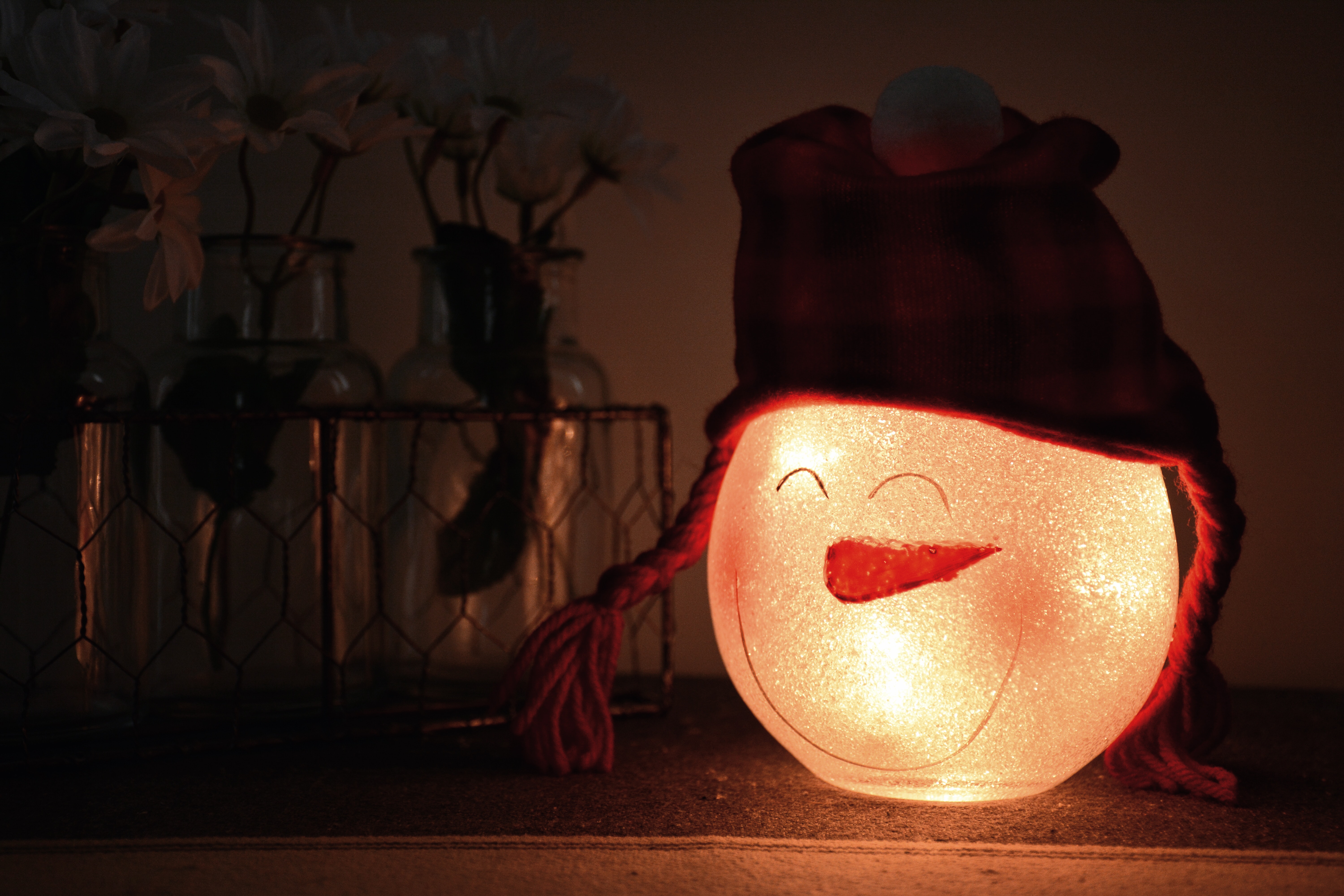 Shallow focus photography of white led snowman lamp