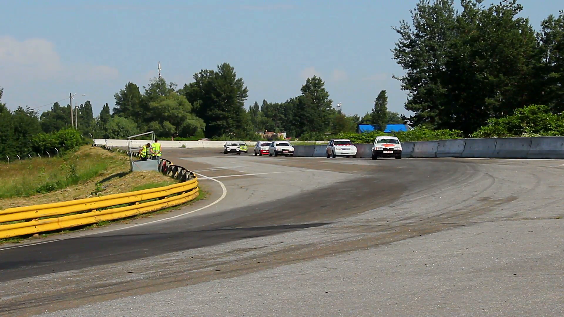 Group of racecars rushing, taking sharp turn, competing for cup ...