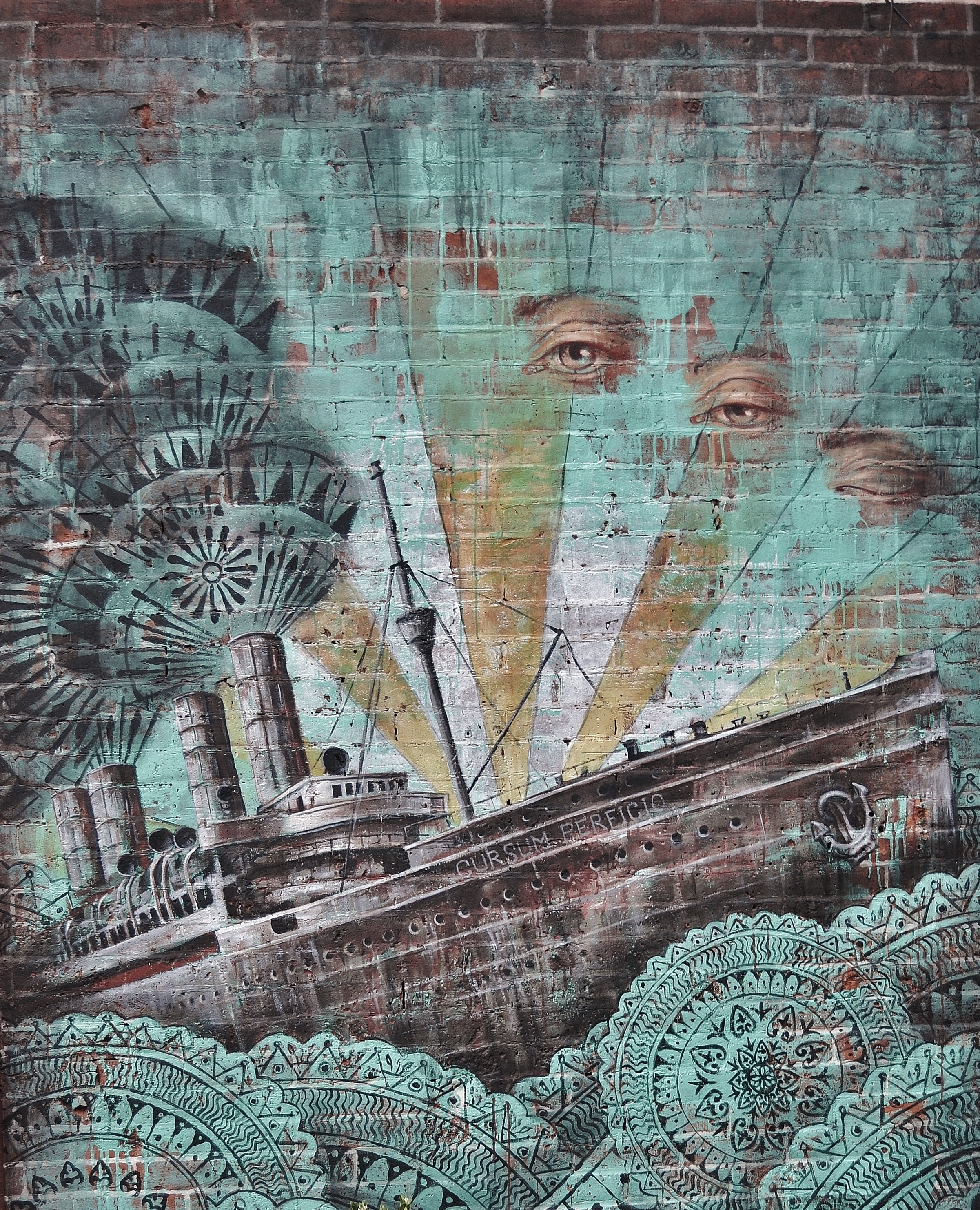 Ship and human eye painted on wall photo