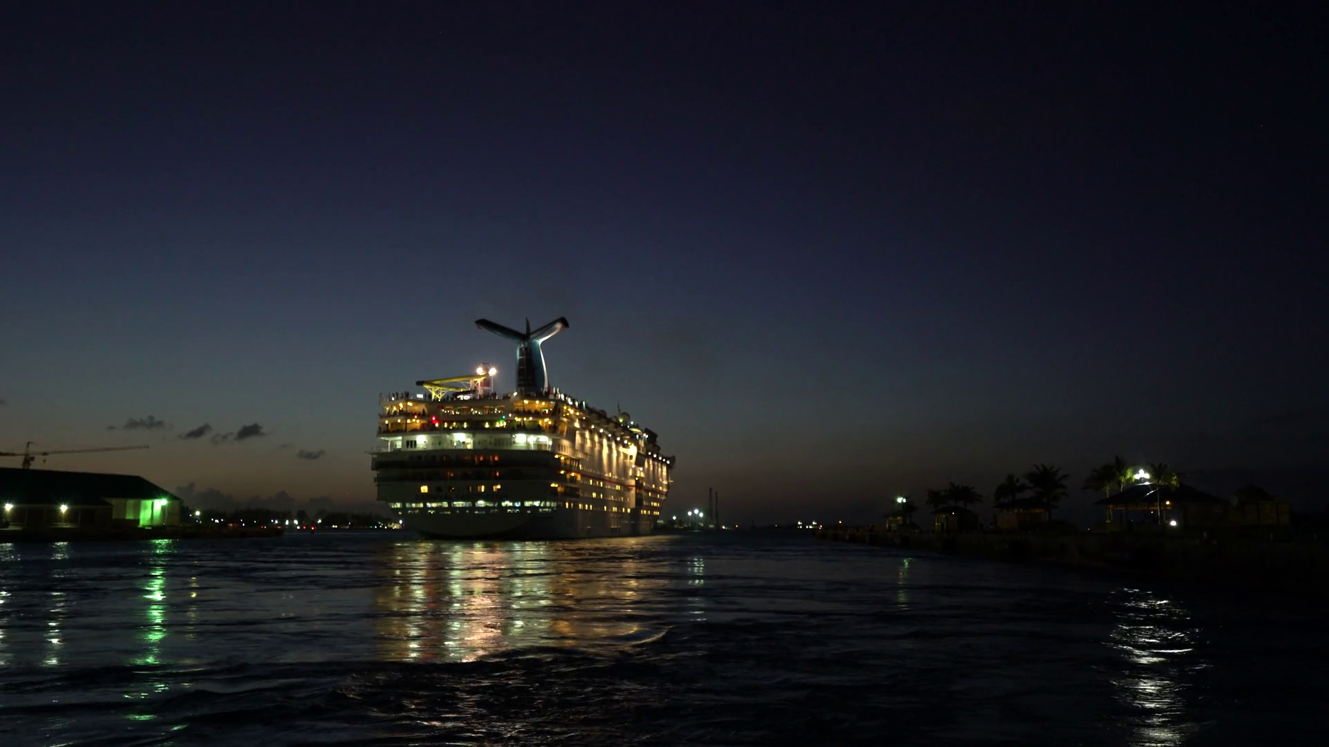 Illuminating cruise ship departs at night - Anthem of the seas ...