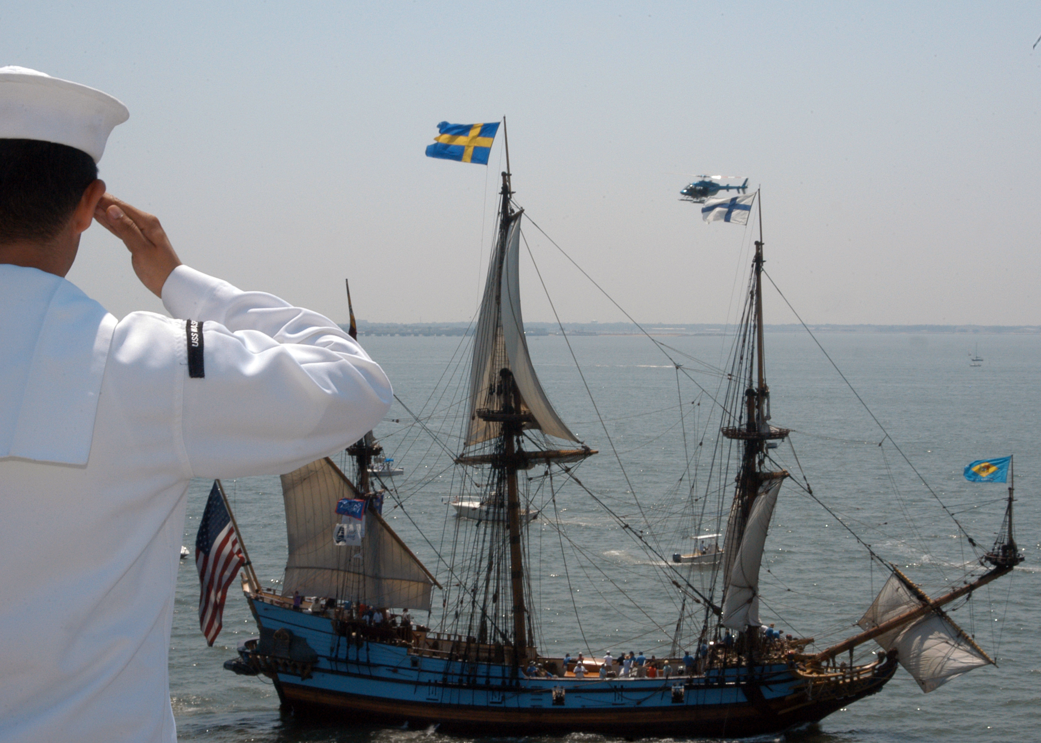 File:US Navy 070608-N-1238B-101 A Sailor salutes a ship from the ...