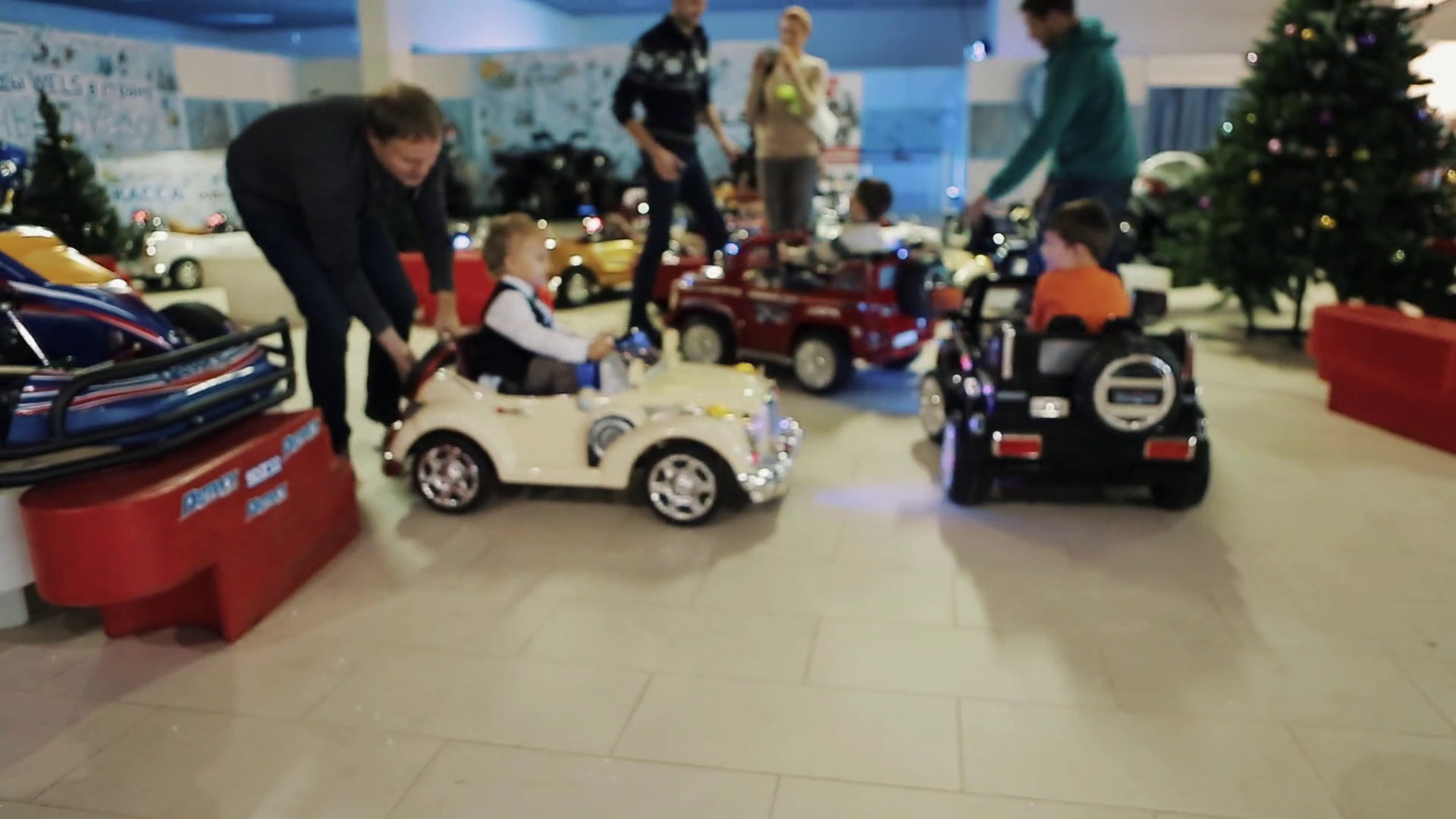 Children riding Battery Operated kids Cars inside shopping mall at ...