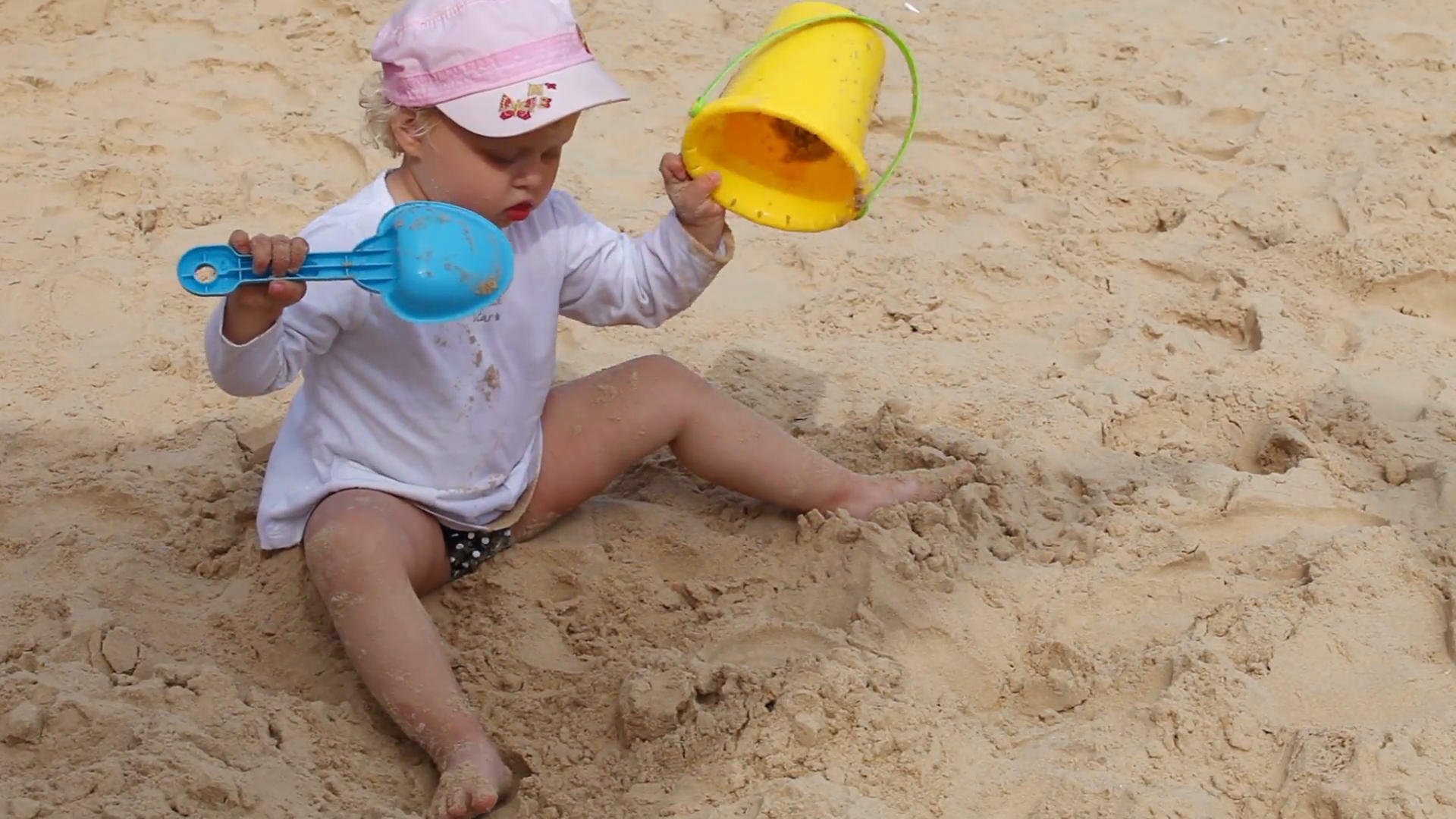 Little Girl Playing Bucket And Shovel Dig On Sand Beach Sea Stock ...