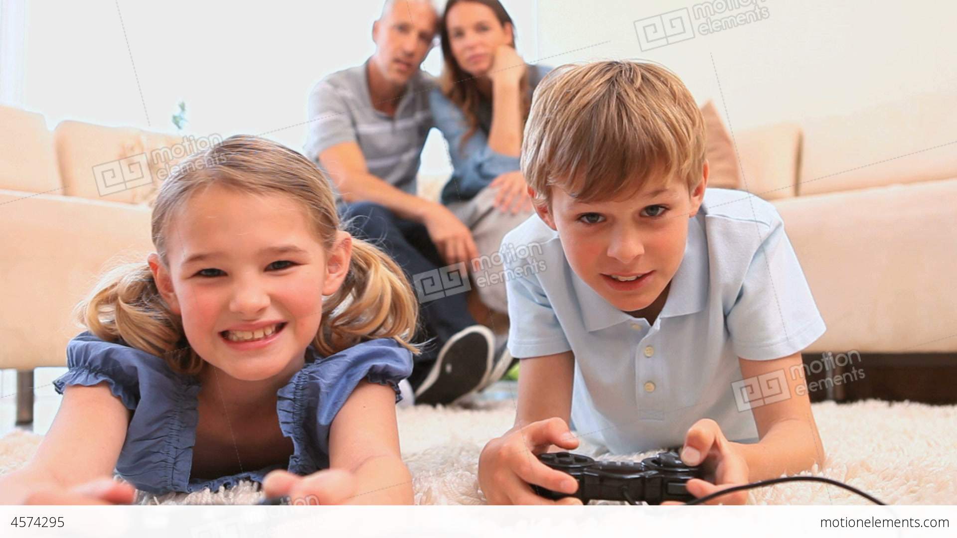 Smiling Siblings Playing Video Games Stock video footage | 4574295