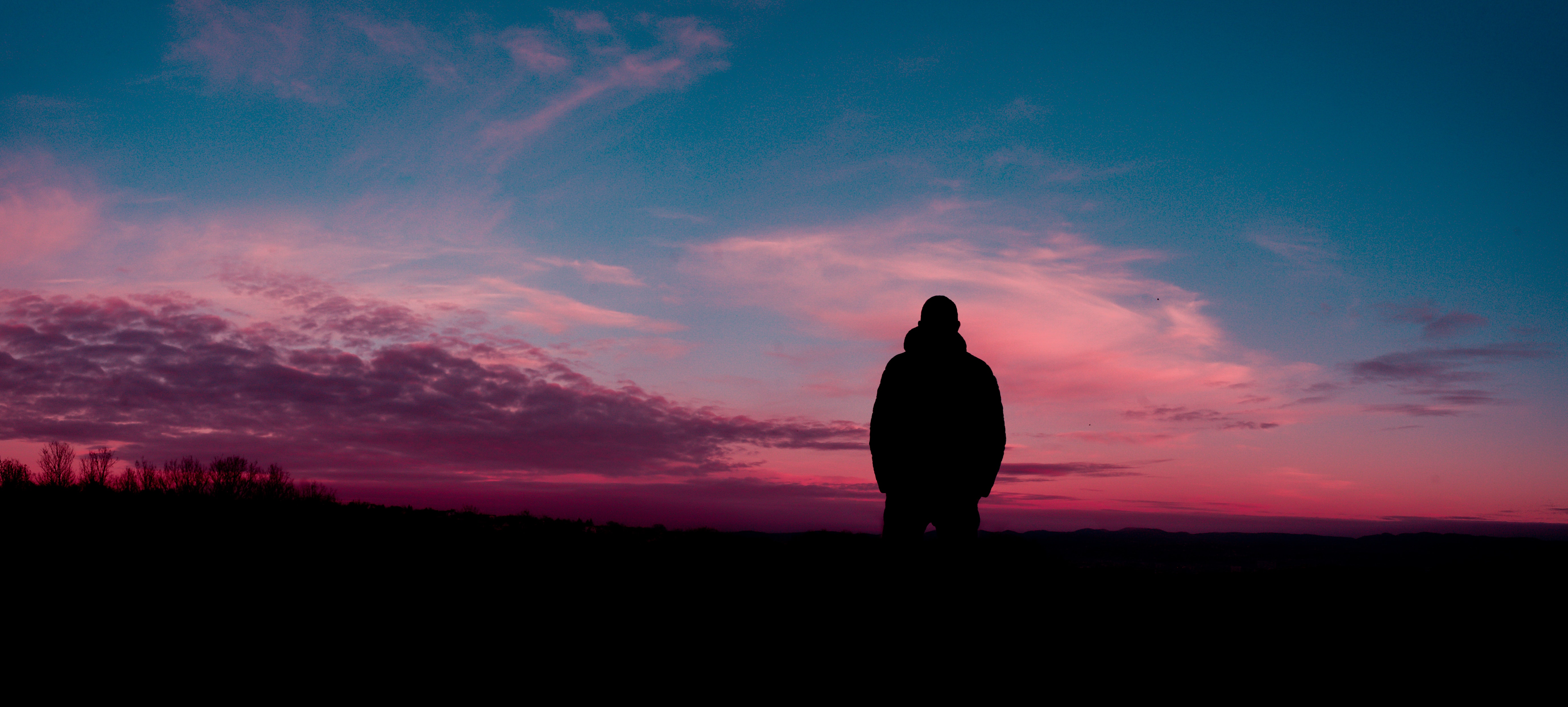 Silhouette of human with sunset background photo