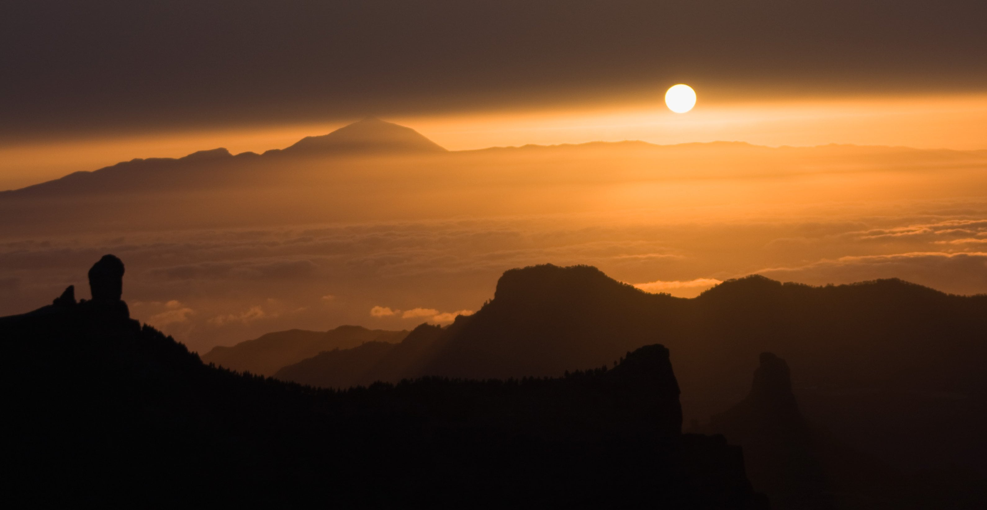 Silhouette of mountains under calm sky during golden hour, el teide ...