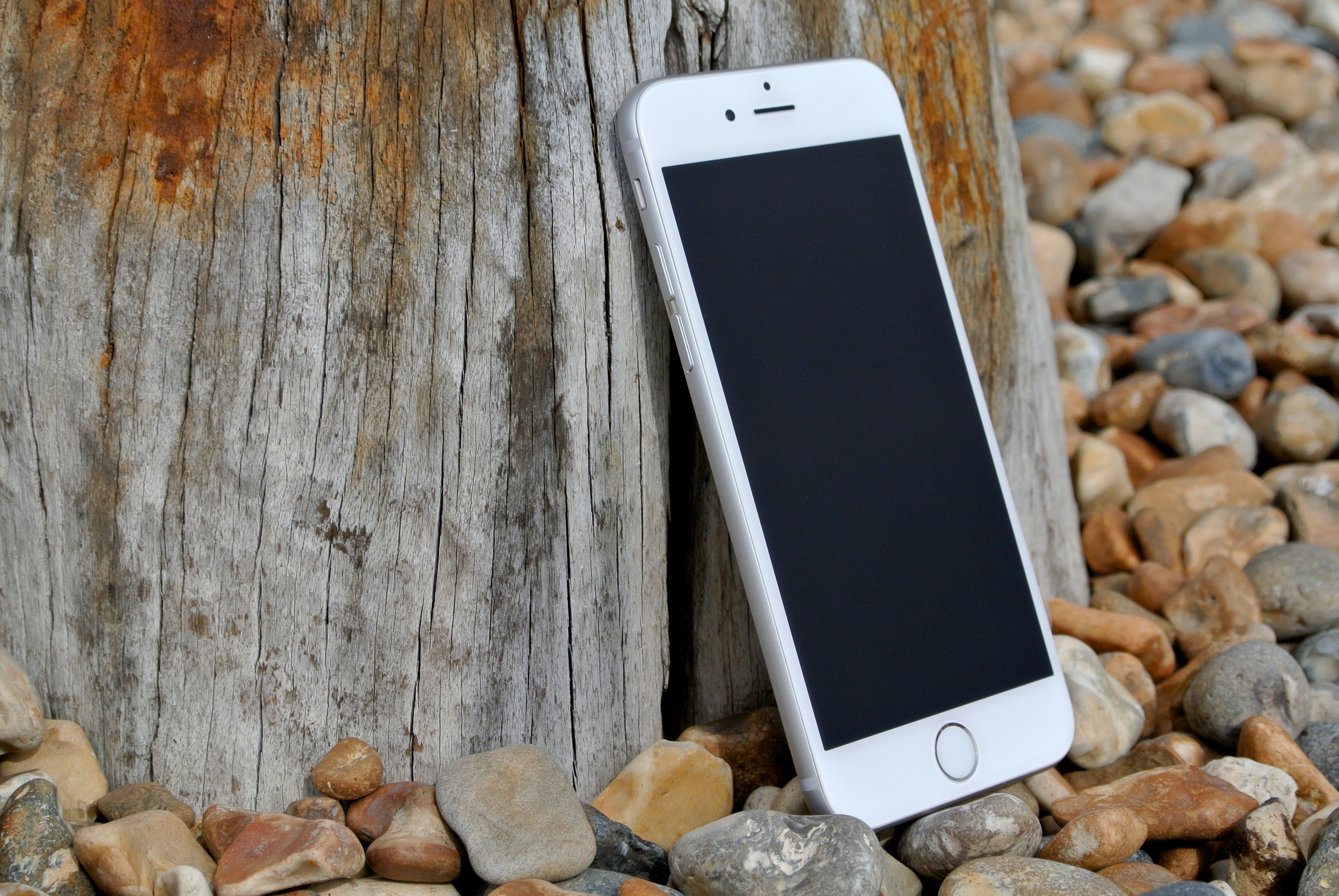 Silver iphone 6 on gray and brown stone photo
